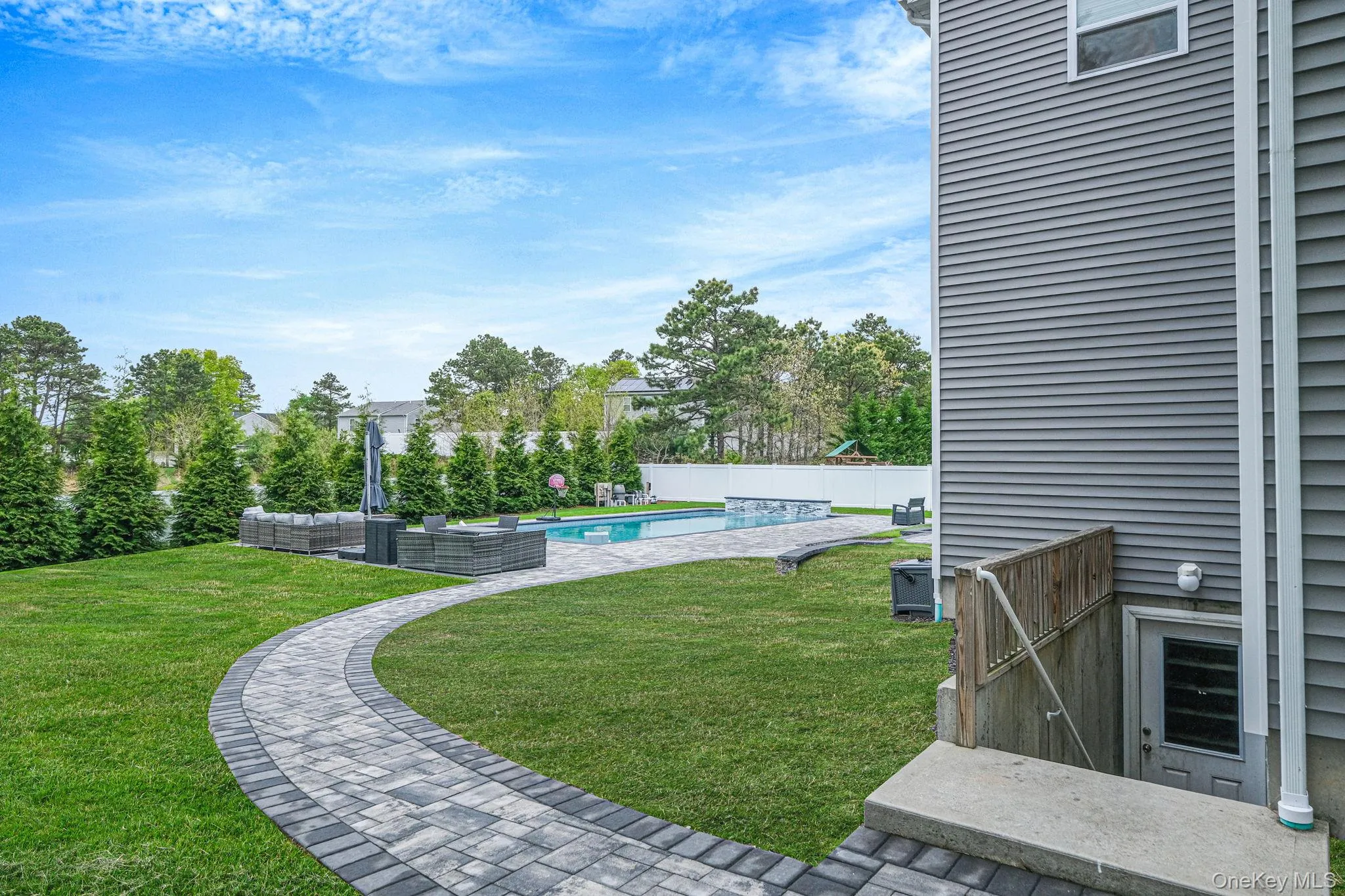 .52 acres with 44’ x 20’ gas-heated Jandy TruGuard mineral in-ground pool with a 10’ sundeck, lounge area, and gorgeous waterfall feature .52 acres with 44’ x 20’ gas-heated Jandy TruGuard mineral in-ground pool with a 10’ sundeck, lounge area, and gorgeous waterfall feature