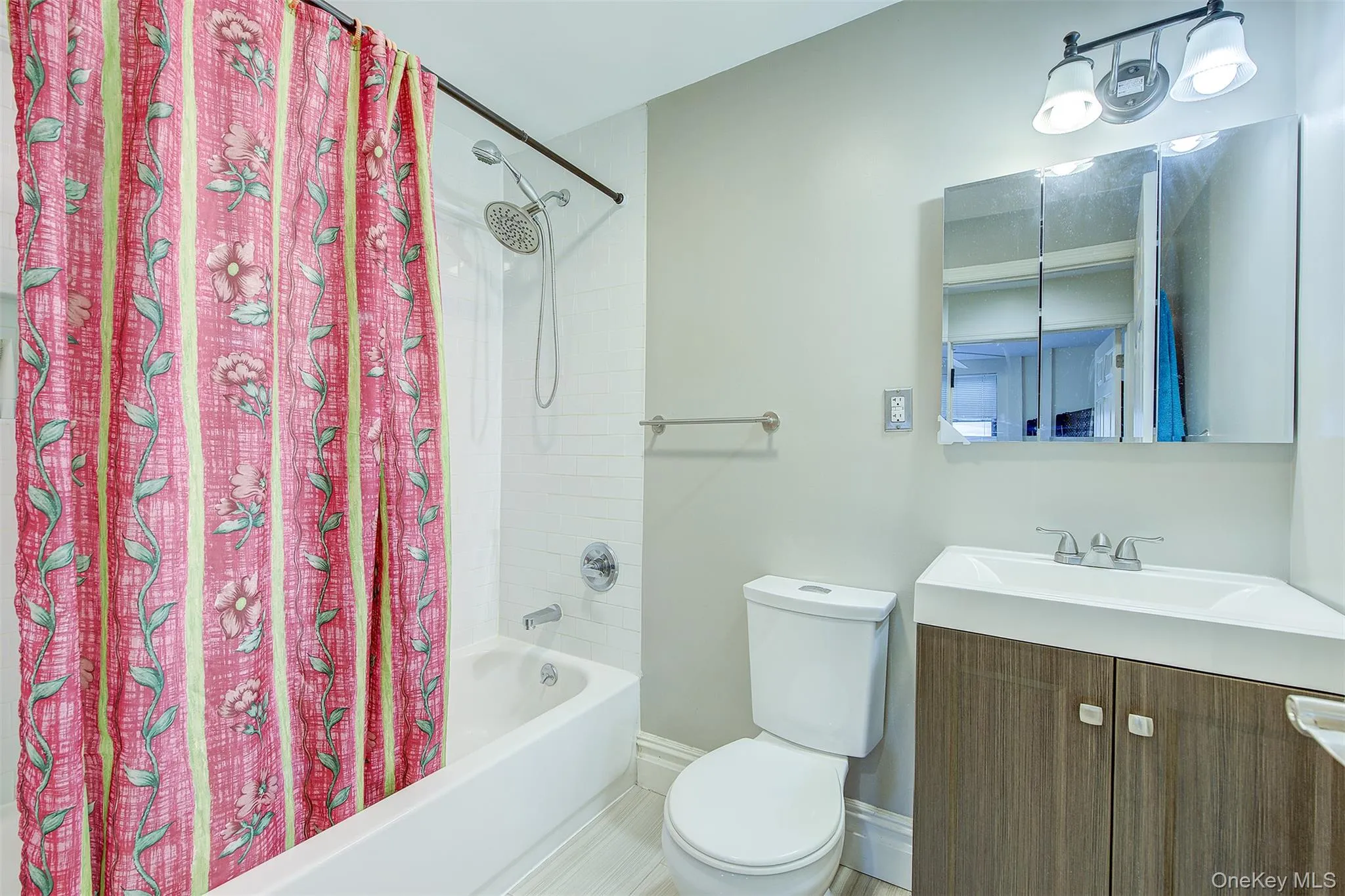 Bathroom featuring vanity and shower / bath combo Bathroom featuring vanity and shower / bath combo