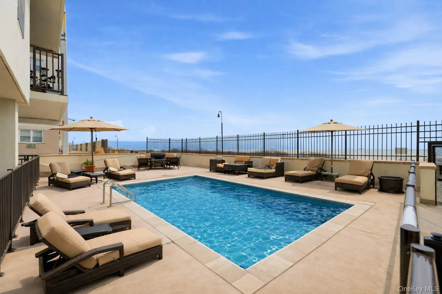 View of swimming pool with patio surround and an outdoor lounge area View of swimming pool with patio surround and an outdoor lounge area