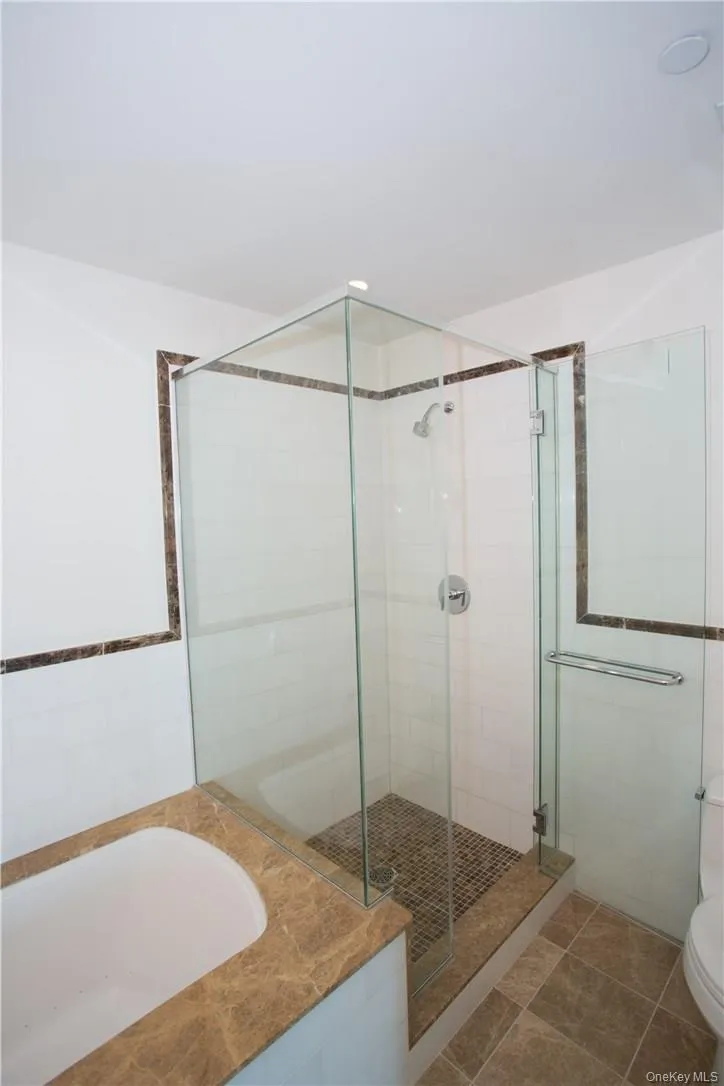 Main bedroom full bath with Jet-Air tub and shower stall. Main bedroom full bath with Jet-Air tub and shower stall.