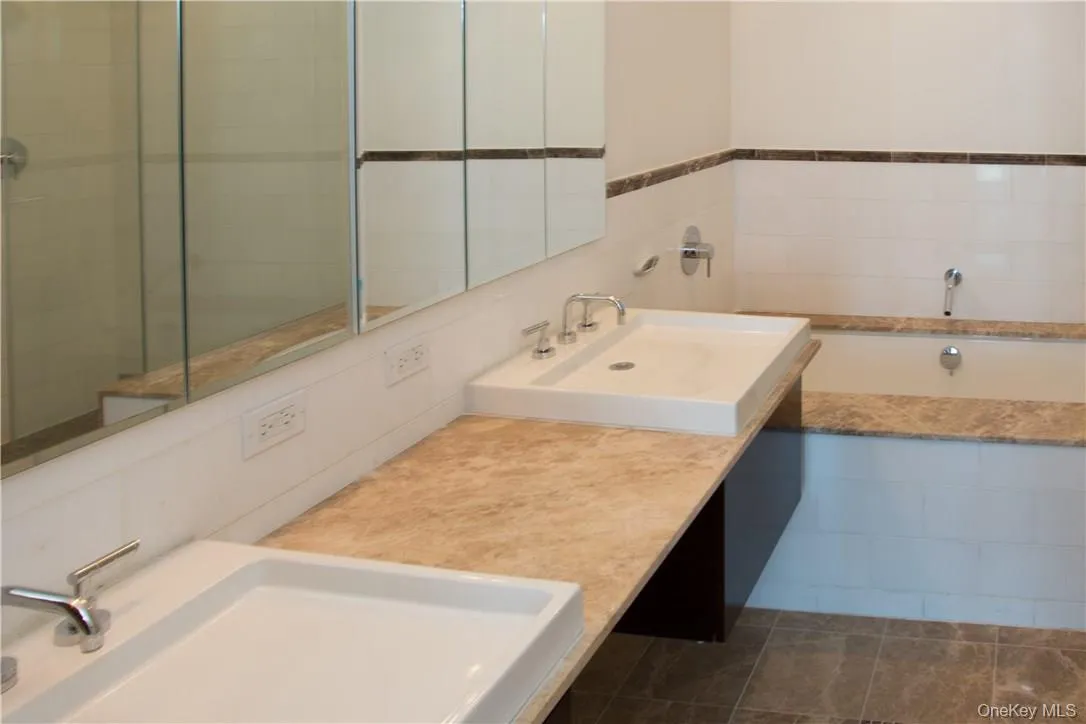 Main bedroom full spa bath includes double vanities, Jet-Air tub, separate shower stall. Main bedroom full spa bath includes double vanities, Jet-Air tub, separate shower stall.