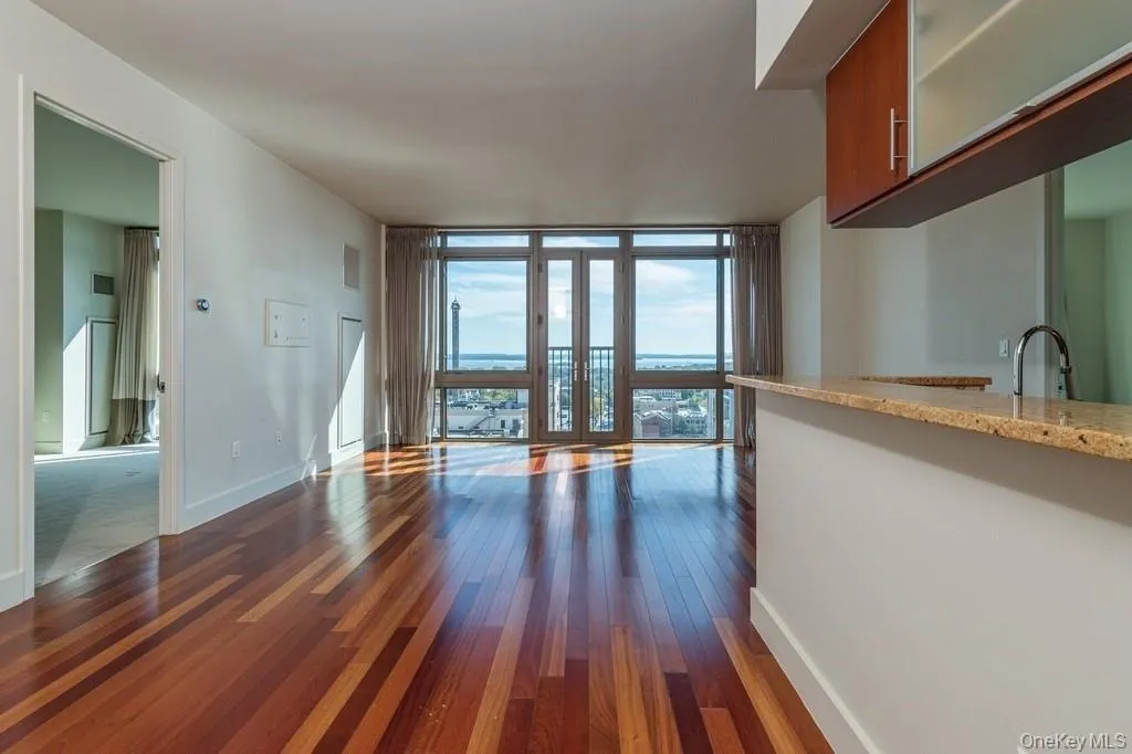 Living room with Juliette doors with amazing water views!! Living room with Juliette doors with amazing water views!!