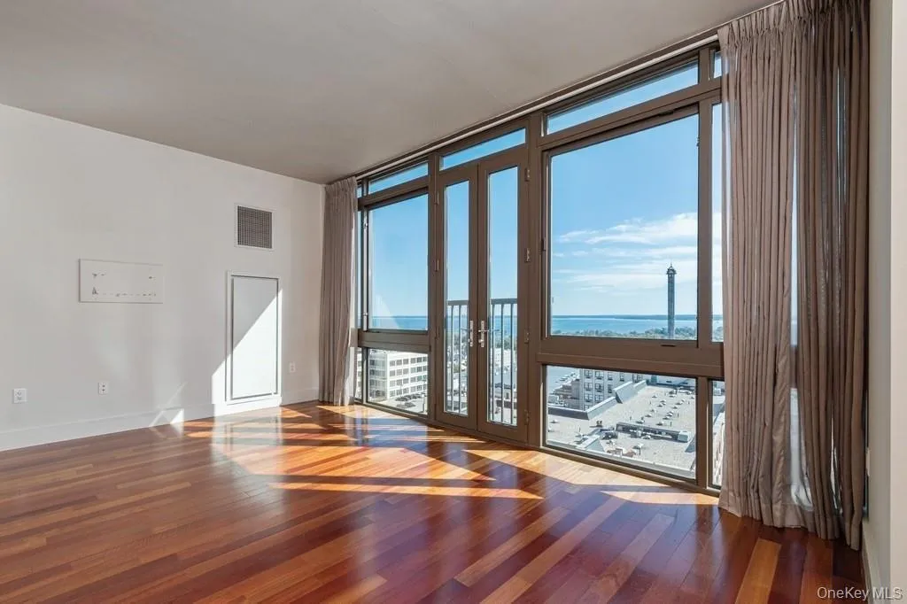 Spacious living room with hardwood floors. Spacious living room with hardwood floors.