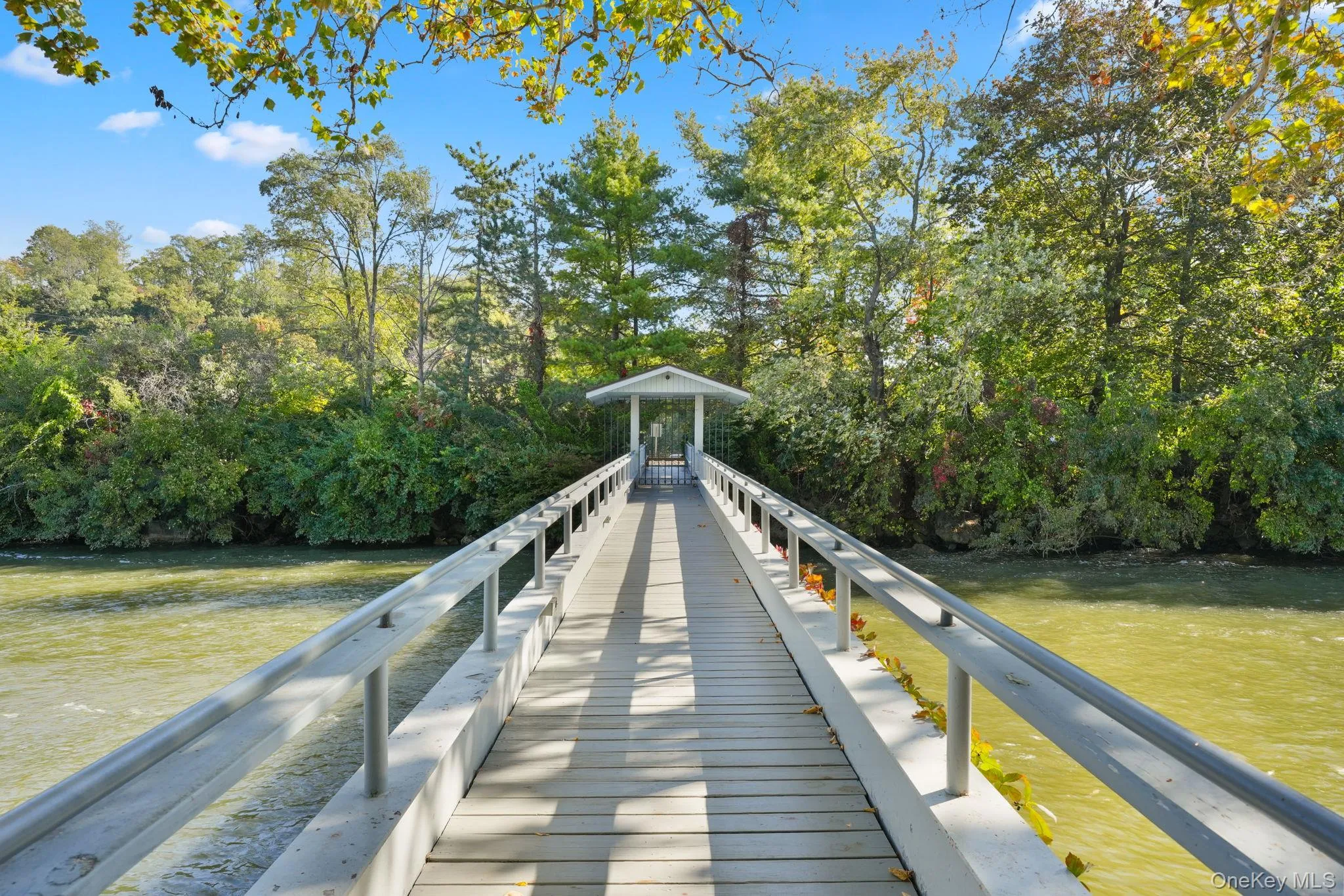 Gated footbridge to the island Gated footbridge to the island