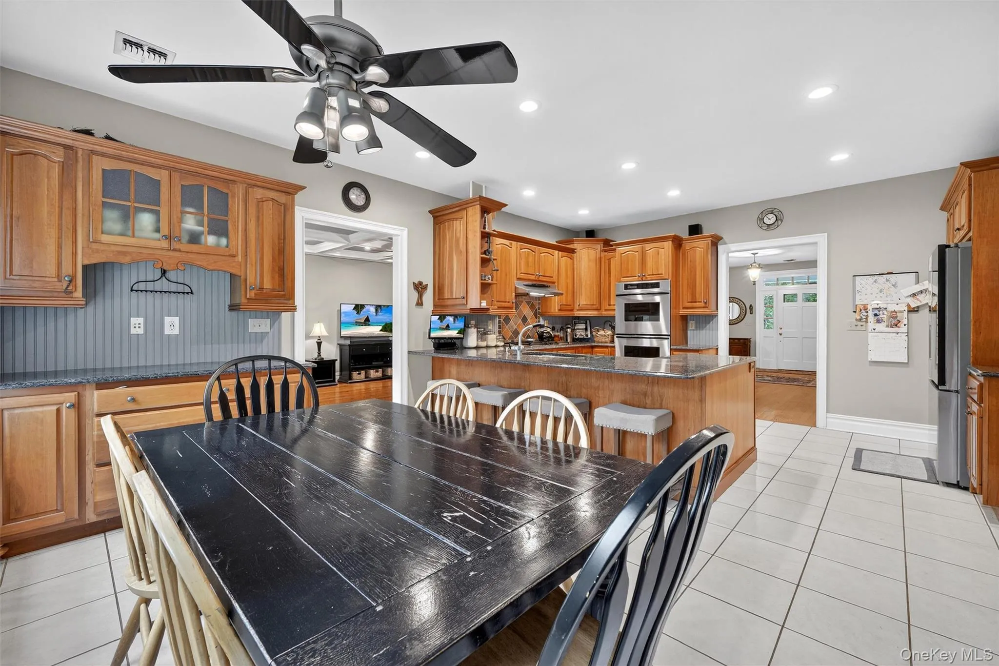 Dining area with ceiling fan, light tile patterned flooring, and recessed lighting Dining area with ceiling fan, light tile patterned flooring, and recessed lighting