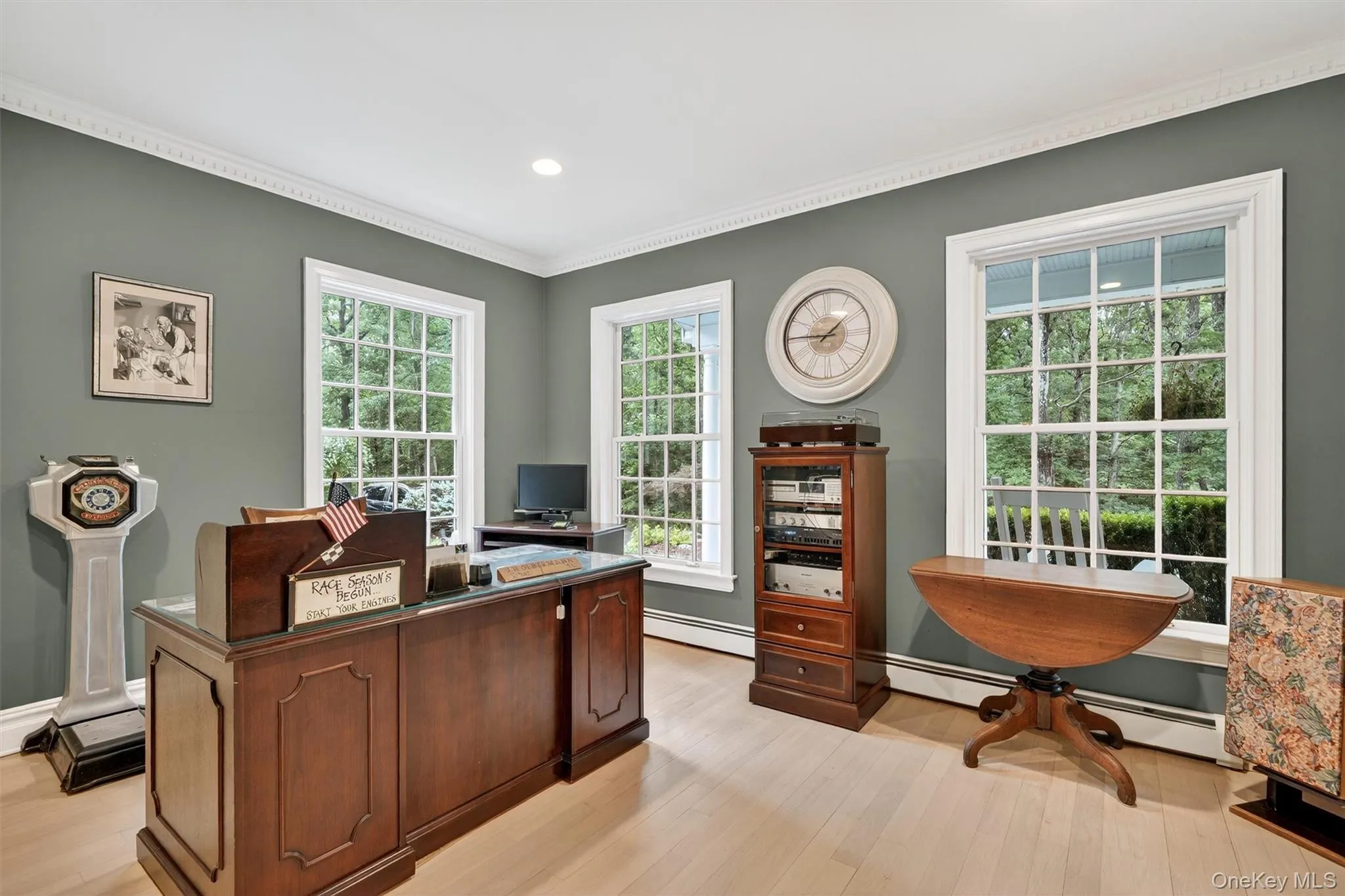 Office area featuring a baseboard radiator, light wood-type flooring, crown molding, and recessed lighting Office area featuring a baseboard radiator, light wood-type flooring, crown molding, and recessed lighting