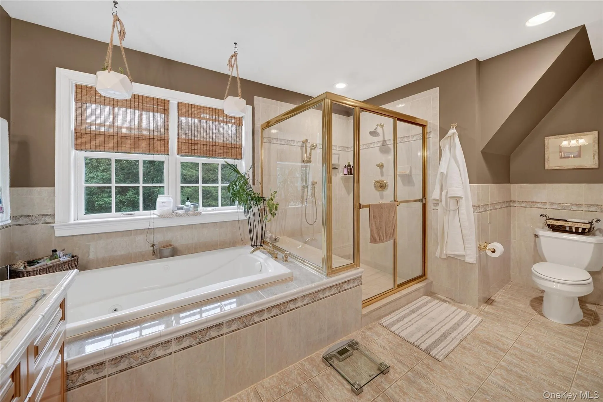 Bathroom featuring a bath, a shower stall, tile patterned flooring, tile walls, and vanity Bathroom featuring a bath, a shower stall, tile patterned flooring, tile walls, and vanity