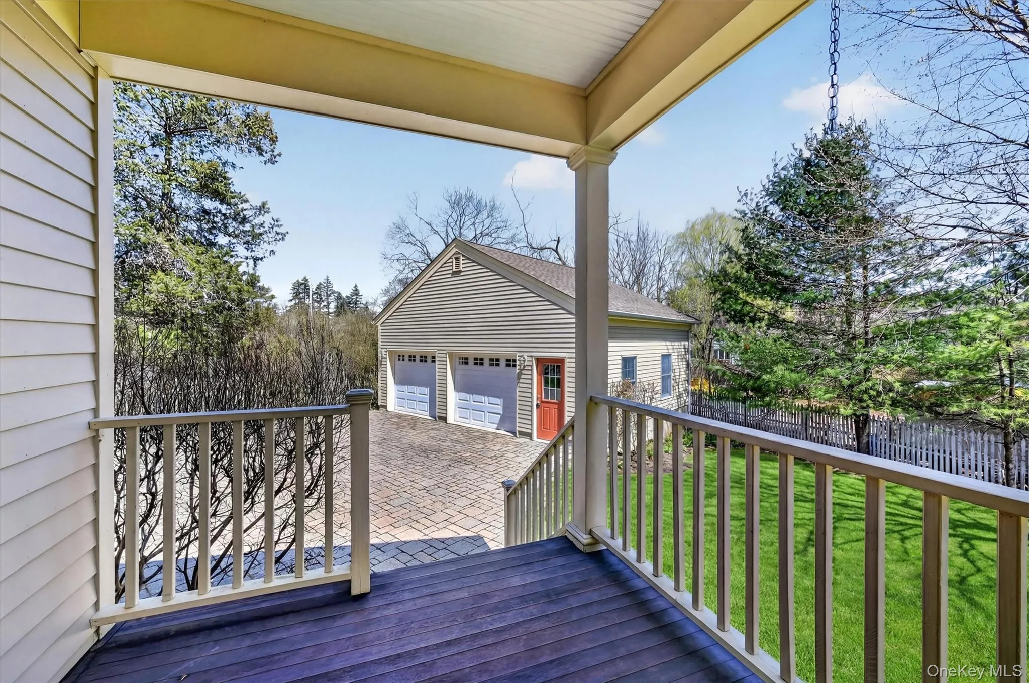 A seamless transition from indoor to outdoor living, this inviting back porch provides a separate entrance to the kitchen, perfect for unloading groceries. A seamless transition from indoor to outdoor living, this inviting back porch provides a separate entrance to the kitchen, perfect for unloading groceries.