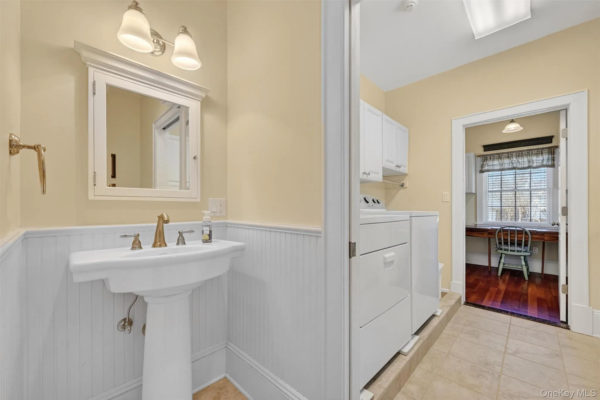 A thoughtfully placed powder room just off the back entry and laundry area is tucked away from the main living spaces, offering both convenience and privacy for guests. A thoughtfully placed powder room just off the back entry and laundry area is tucked away from the main living spaces, offering both convenience and privacy for guests.
