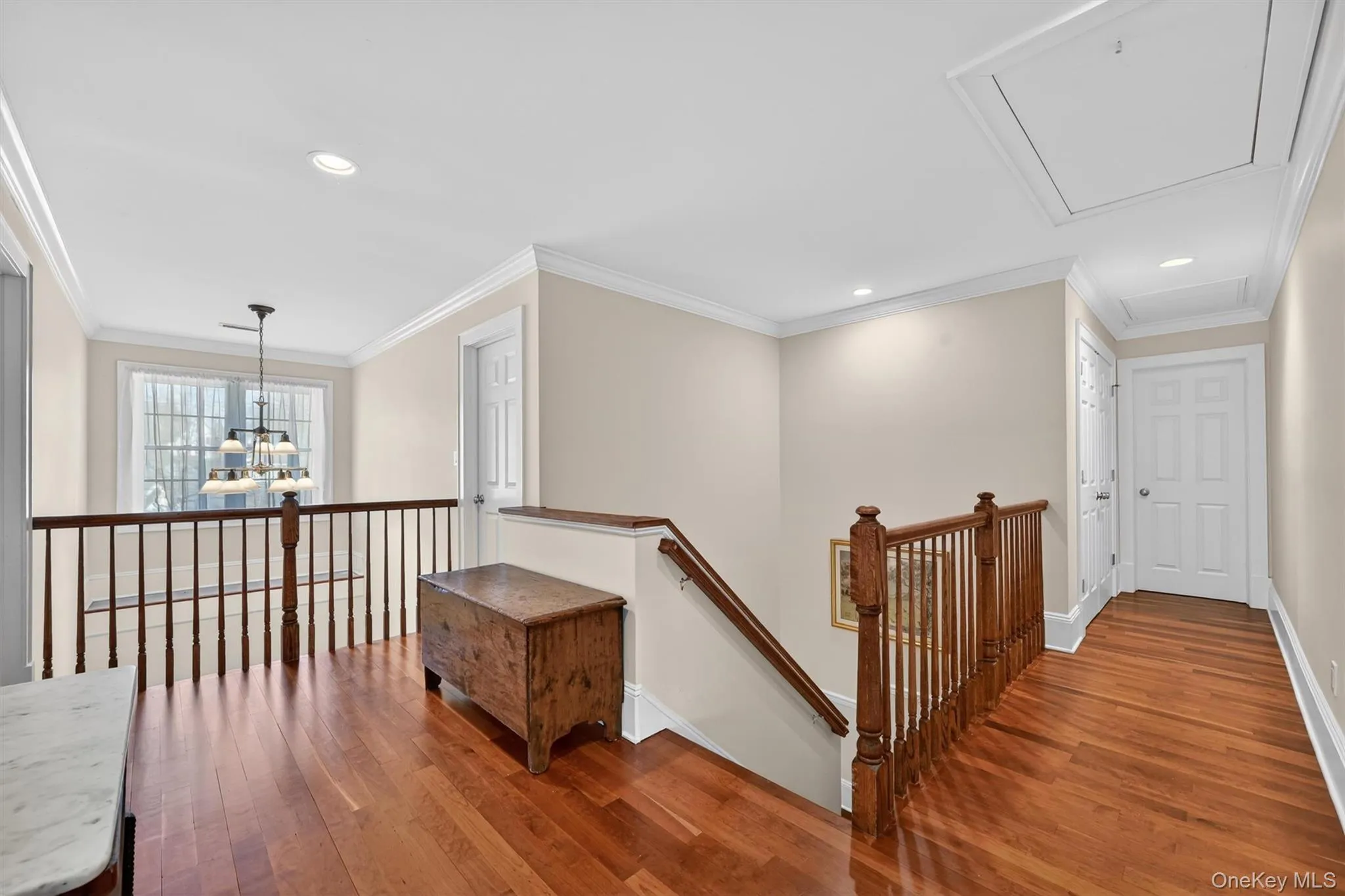 The second-floor landing provides a spacious and open transition between rooms, with the beautiful Brazilian Cherry hardwood floors continuing upstairs and a welcoming feel throughout. The second-floor landing provides a spacious and open transition between rooms, with the beautiful Brazilian Cherry hardwood floors continuing upstairs and a welcoming feel throughout.