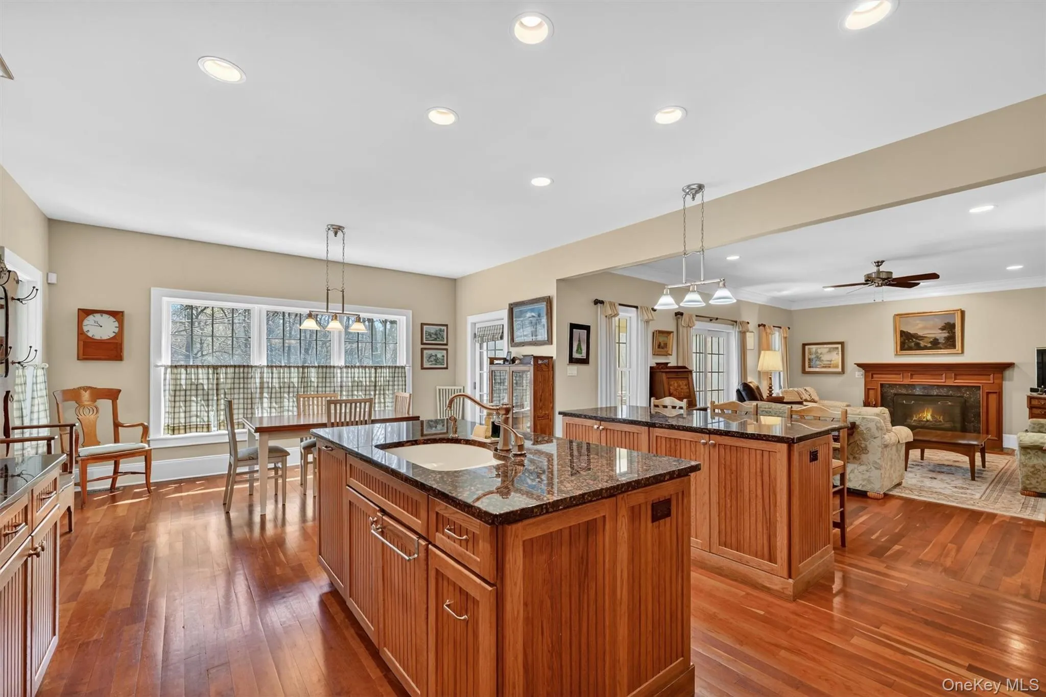 Designed for effortless entertaining, the kitchen opens seamlessly to the family room and the screened porch, creating a spacious and connected environment for holidays and everyday living. Designed for effortless entertaining, the kitchen opens seamlessly to the family room and the screened porch, creating a spacious and connected environment for holidays and everyday living.