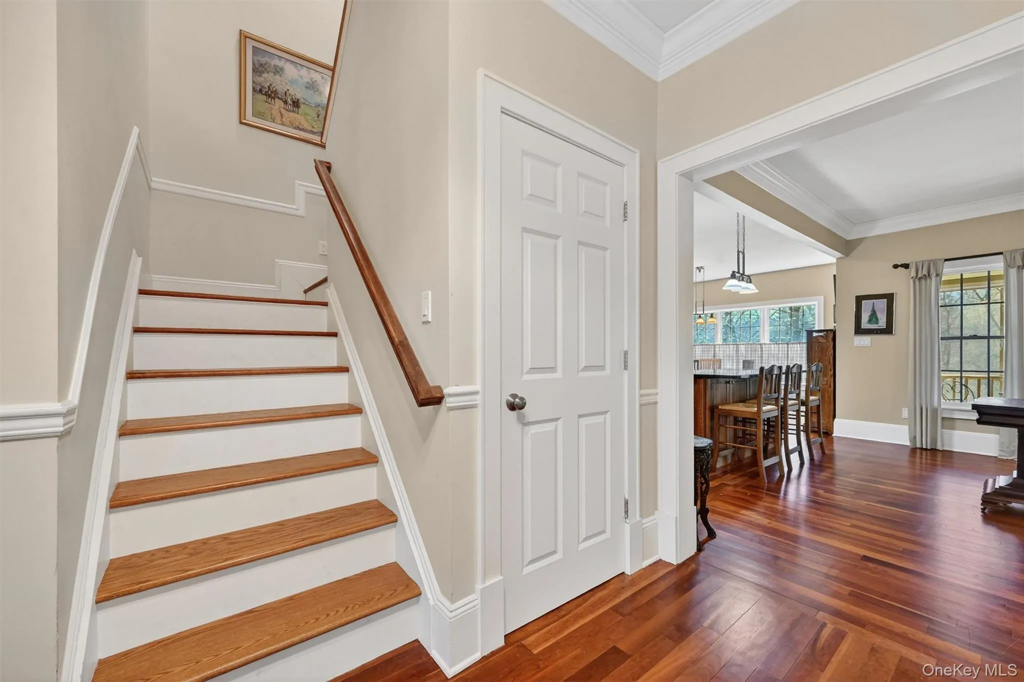 The staircase to the second level is both inviting and refined, featuring rich wood treads and classic detailing that complement the home’s timeless style. The staircase to the second level is both inviting and refined, featuring rich wood treads and classic detailing that complement the home’s timeless style.