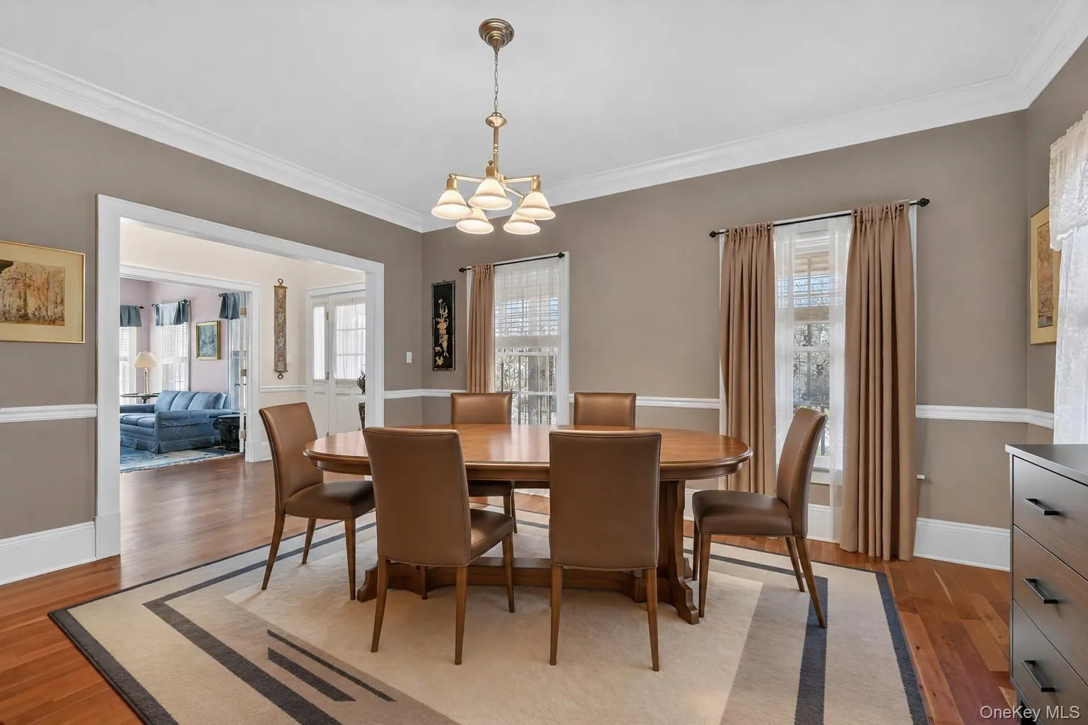 A virtually staged image of the dining room reflects a more modern look. A virtually staged image of the dining room reflects a more modern look.