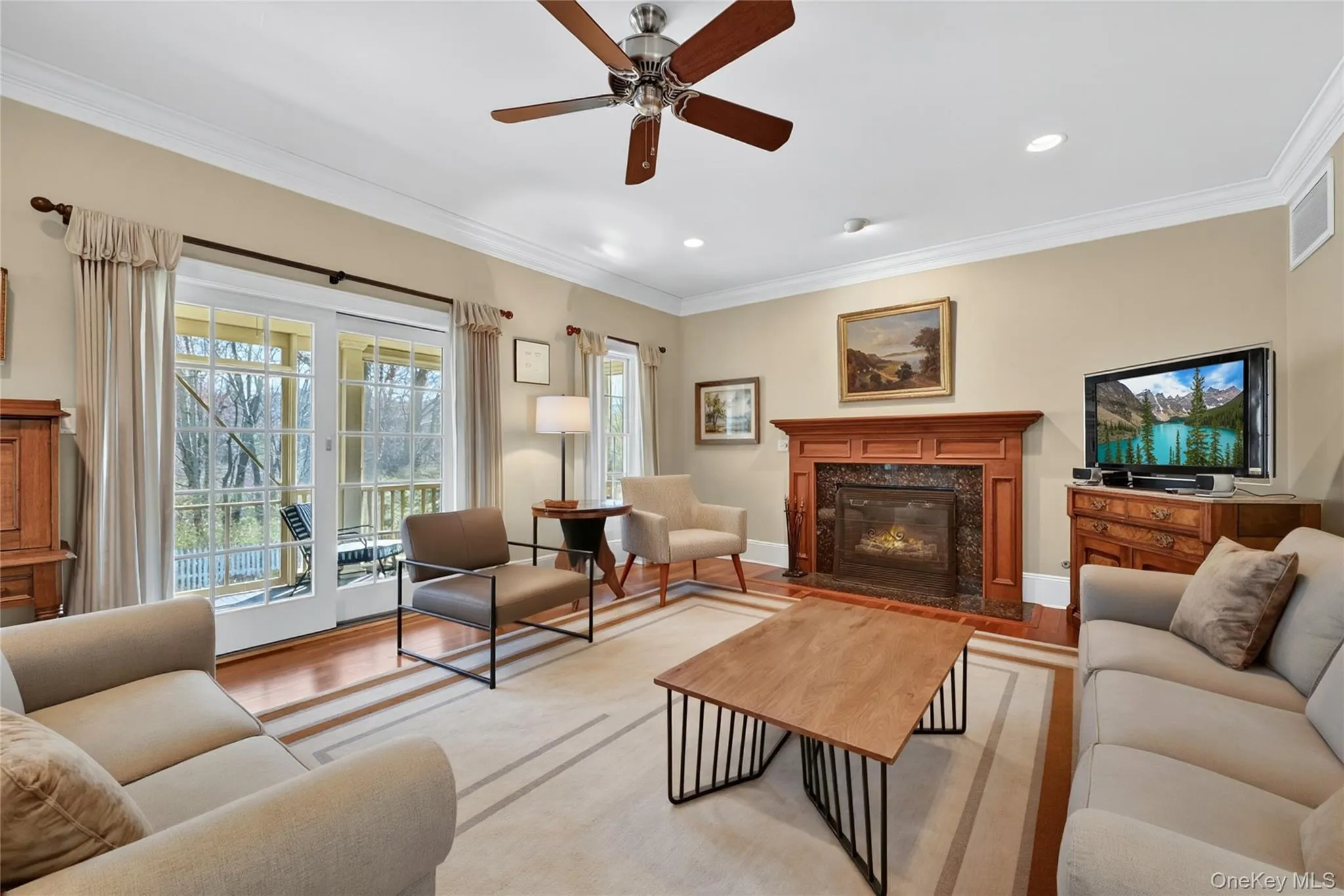 A virtually staged image of the family room with a more modern look. A virtually staged image of the family room with a more modern look.