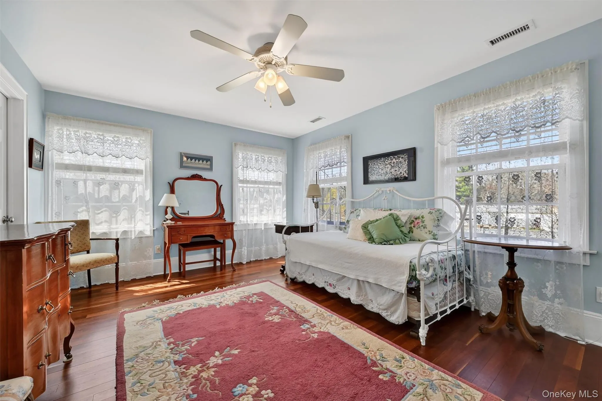 One of three generously sized second-floor bedrooms, filled with natural light and offering a peaceful and inviting retreat. One of three generously sized second-floor bedrooms, filled with natural light and offering a peaceful and inviting retreat.