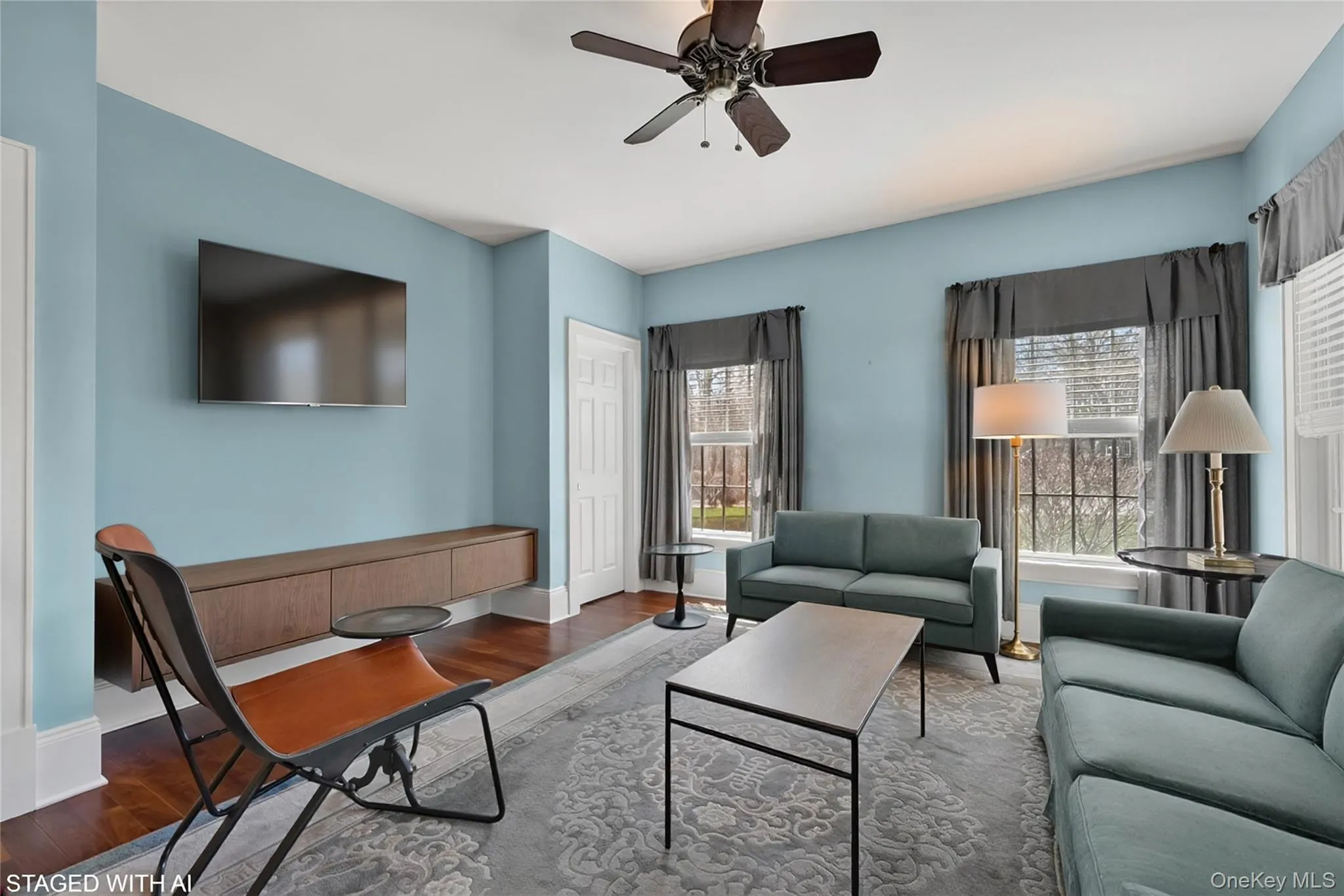 A virtually staged image of the living room presents a more modern look. A virtually staged image of the living room presents a more modern look.