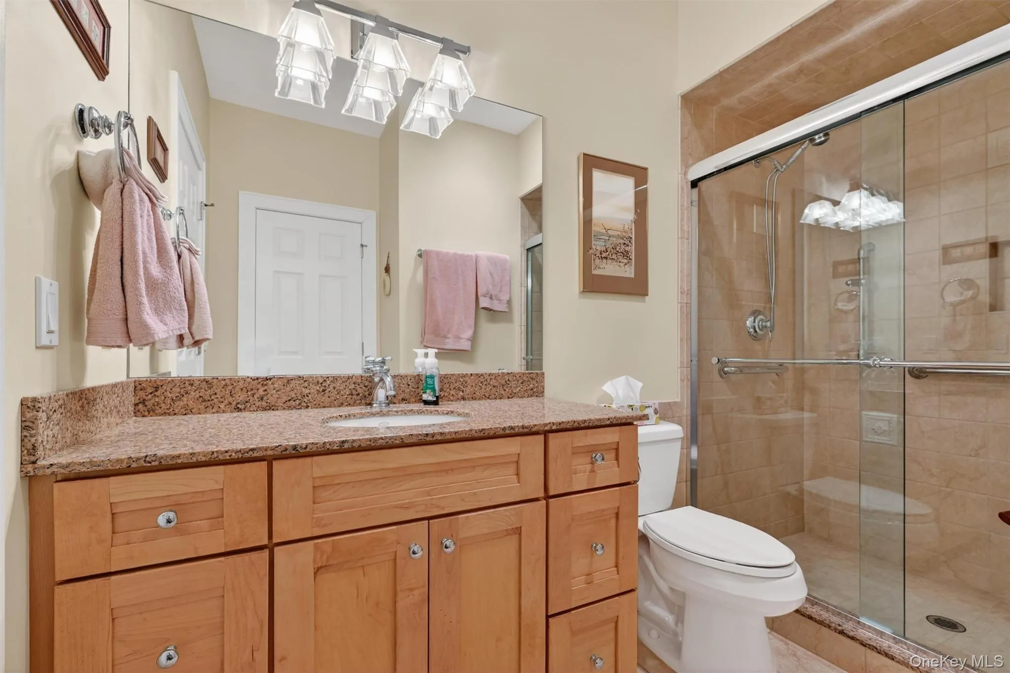 A main floor full bathroom is designed for everyday functionality and convenience. The full bath (with doors to both the hallway and the bedroom) offers the option to use the main level bedroom as a second primary suite. A main floor full bathroom is designed for everyday functionality and convenience. The full bath (with doors to both the hallway and the bedroom) offers the option to use the main level bedroom as a second primary suite.