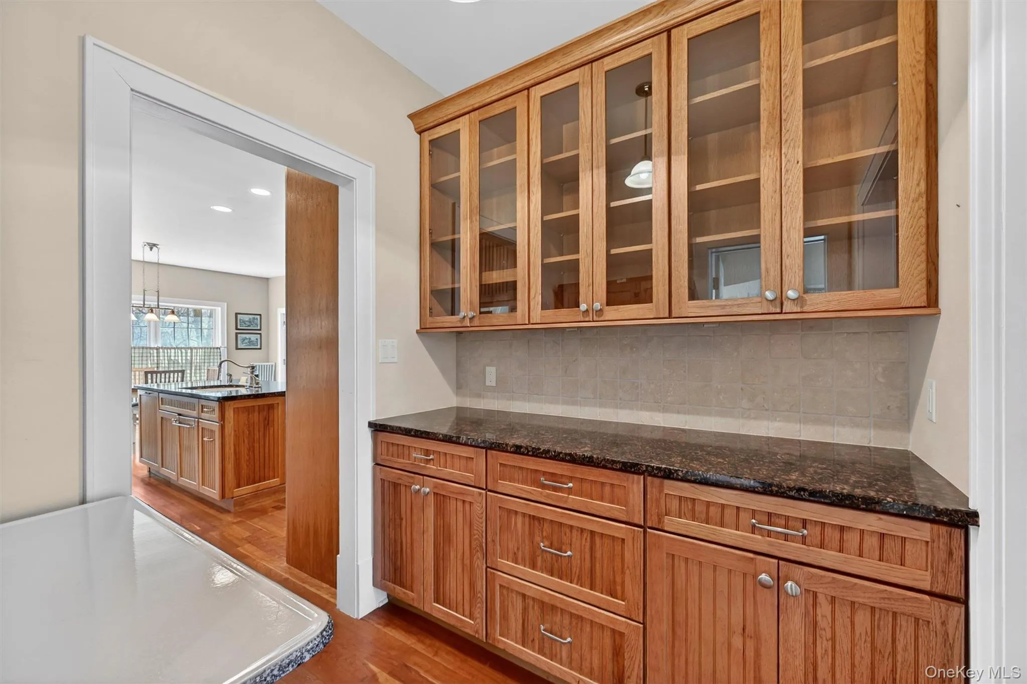 The butler’s pantry offers generous cabinetry and counter space, making entertaining and everyday functionality both seamless and convenient. It connects the kitchen to the formal dining room. The butler’s pantry offers generous cabinetry and counter space, making entertaining and everyday functionality both seamless and convenient. It connects the kitchen to the formal dining room.