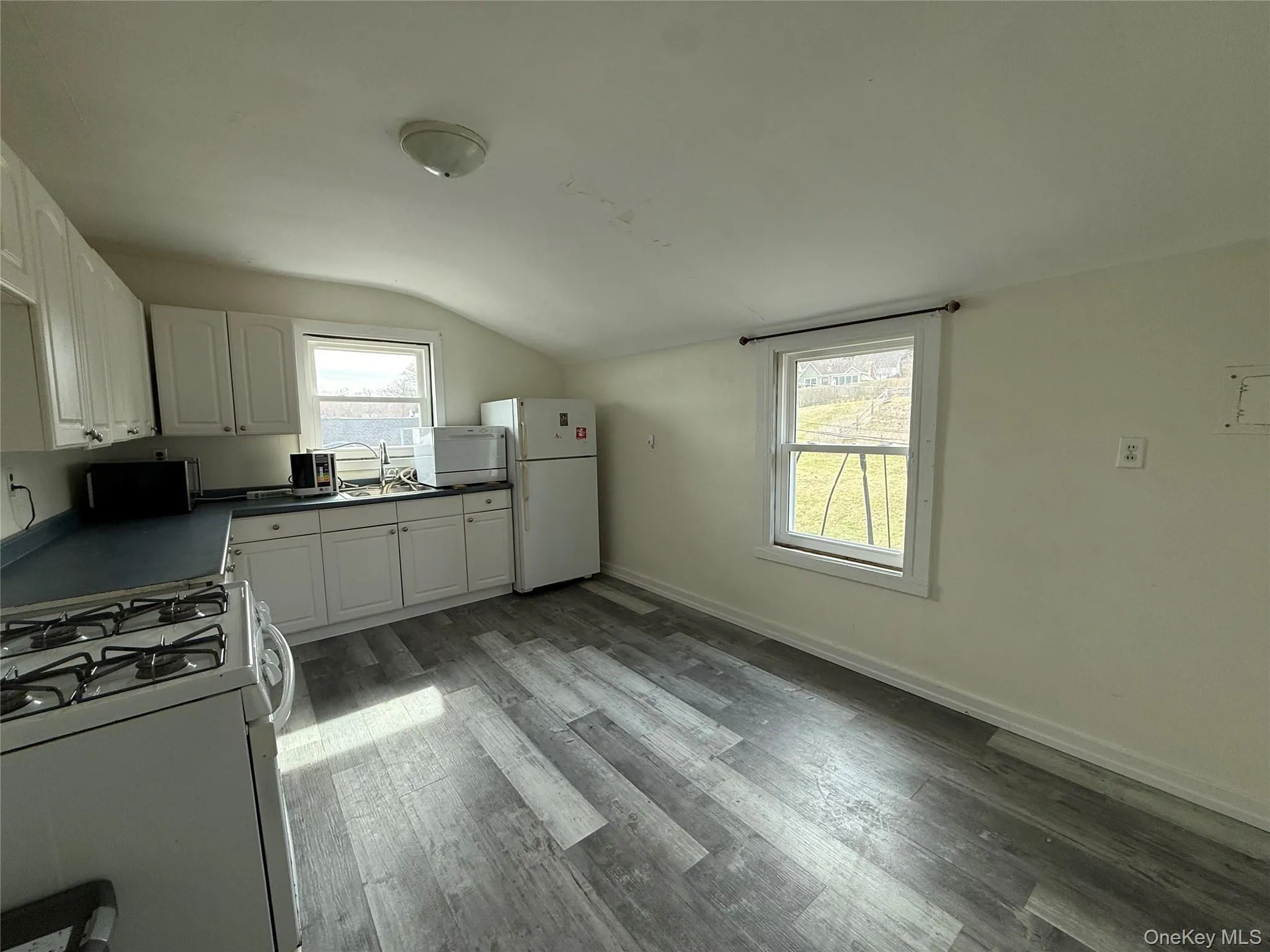 Eat-in kitchen with white cabinets Eat-in kitchen with white cabinets