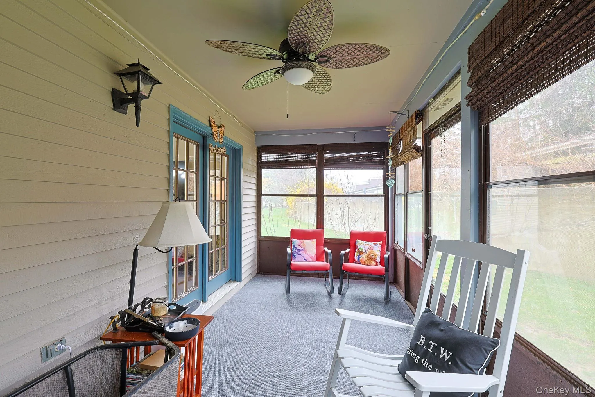 Covered patio with ceiling fan and storage. Covered patio with ceiling fan and storage.