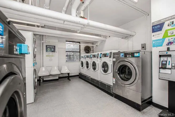 Community laundry room with washer and clothes dryer Community laundry room with washer and clothes dryer