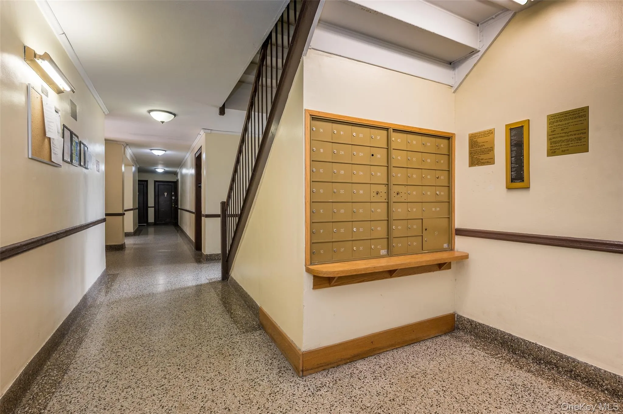 Hallway with speckle patterned floor and mail area Hallway with speckle patterned floor and mail area