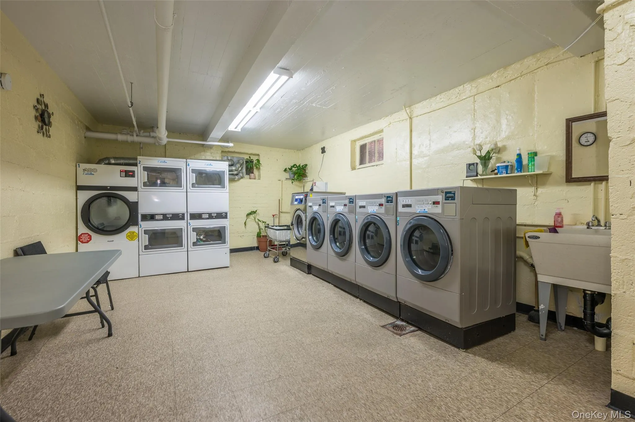 Shared laundry with washing machine and clothes dryer Shared laundry with washing machine and clothes dryer
