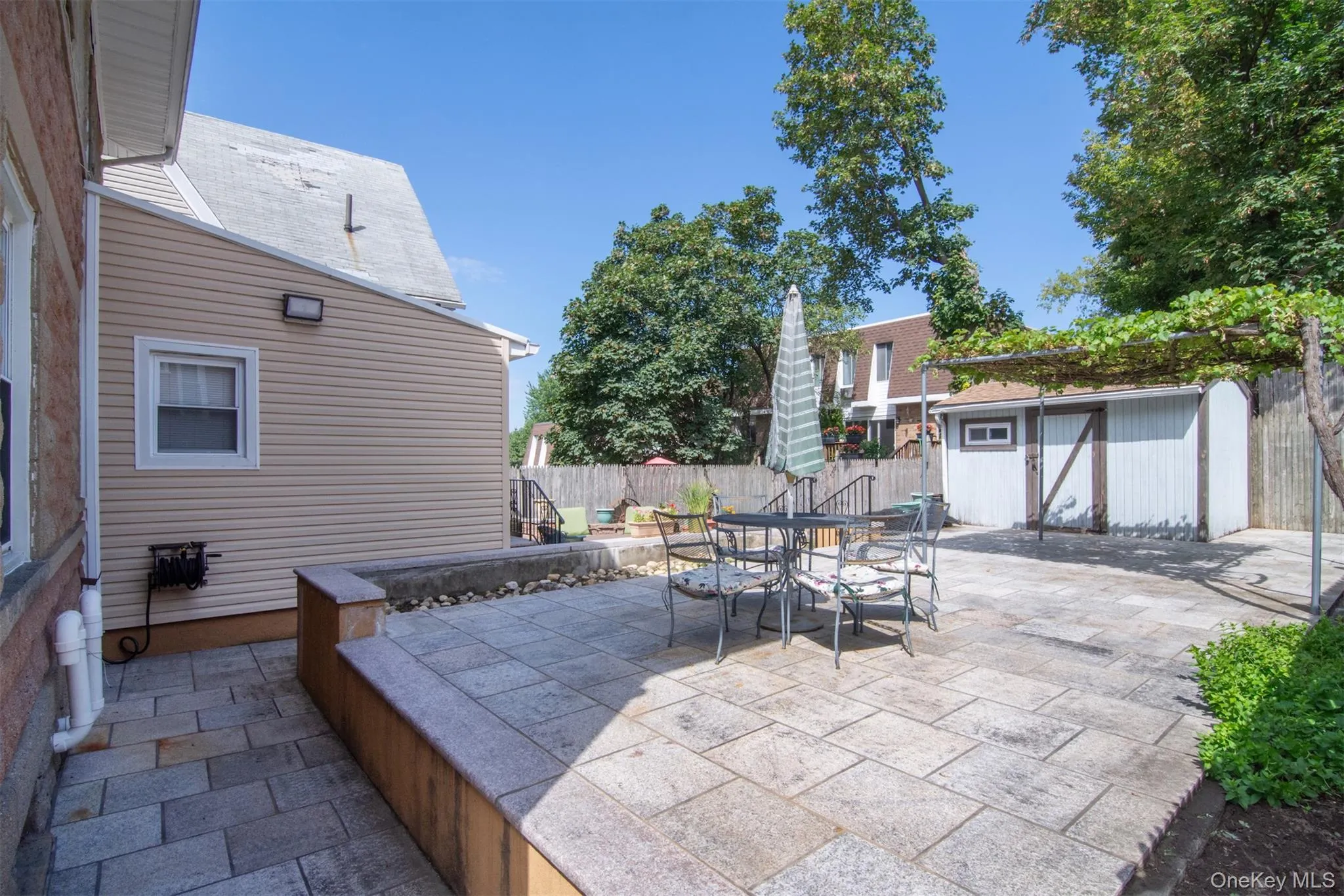 Upper Patio with sizeable Shed in Back ground Upper Patio with sizeable Shed in Back ground