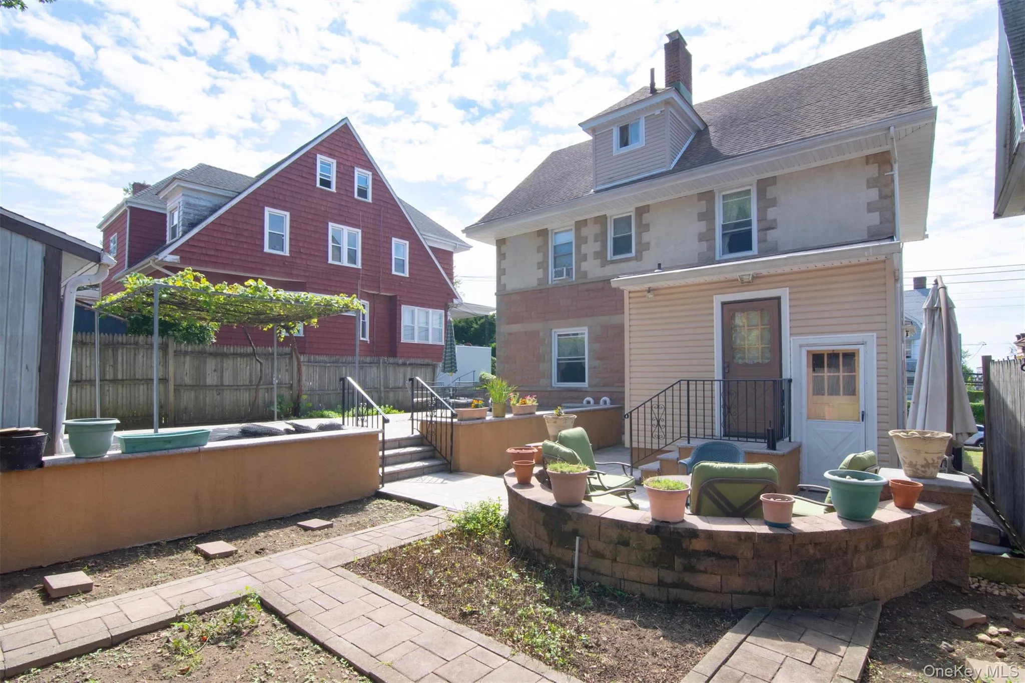 Low Maintenance, Fenced Backyard. Patios, Garden and Grapevines Low Maintenance, Fenced Backyard. Patios, Garden and Grapevines