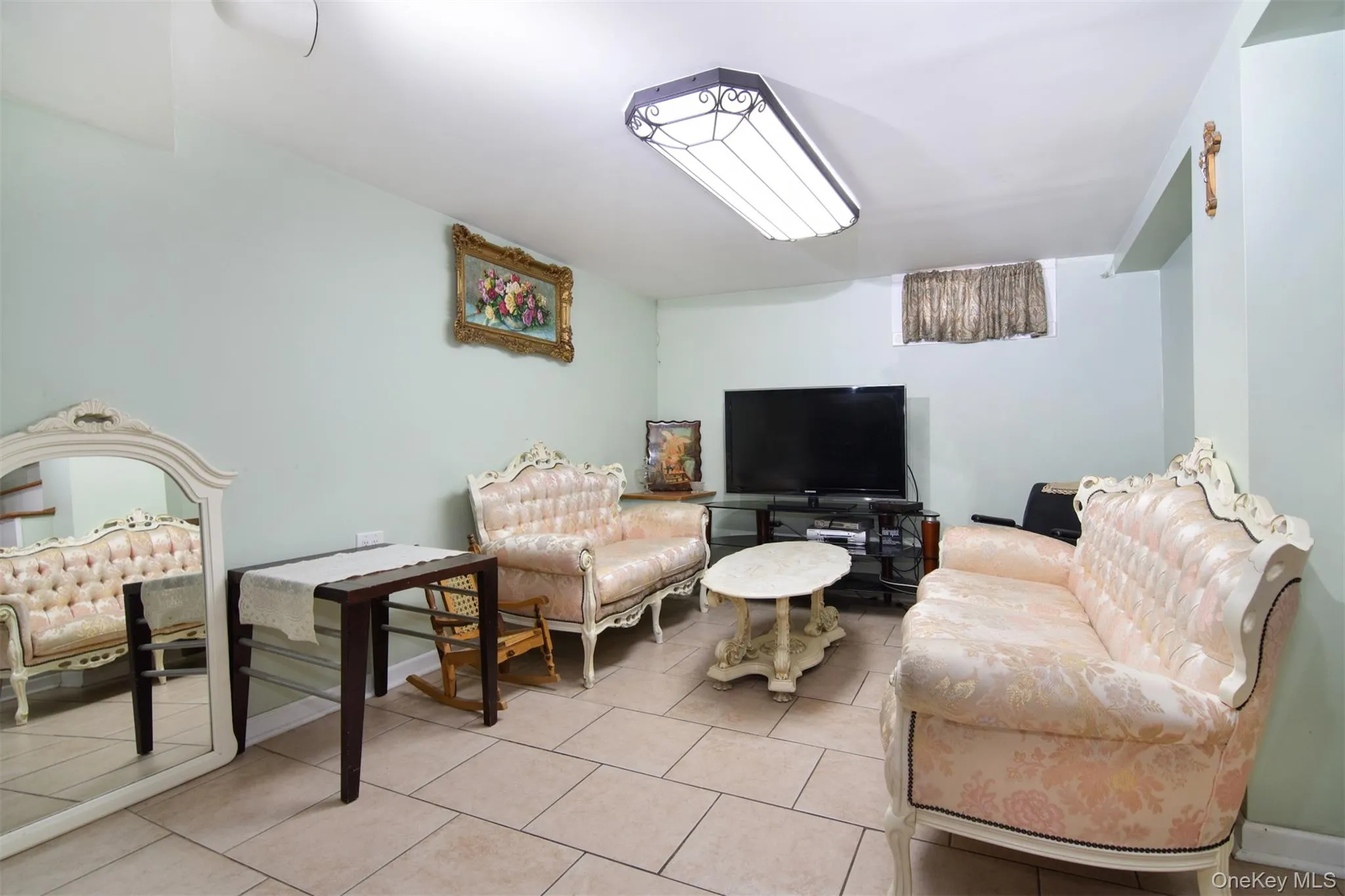 Tiled lower level Family Room with 1/2 bath and Utility Room Tiled lower level Family Room with 1/2 bath and Utility Room