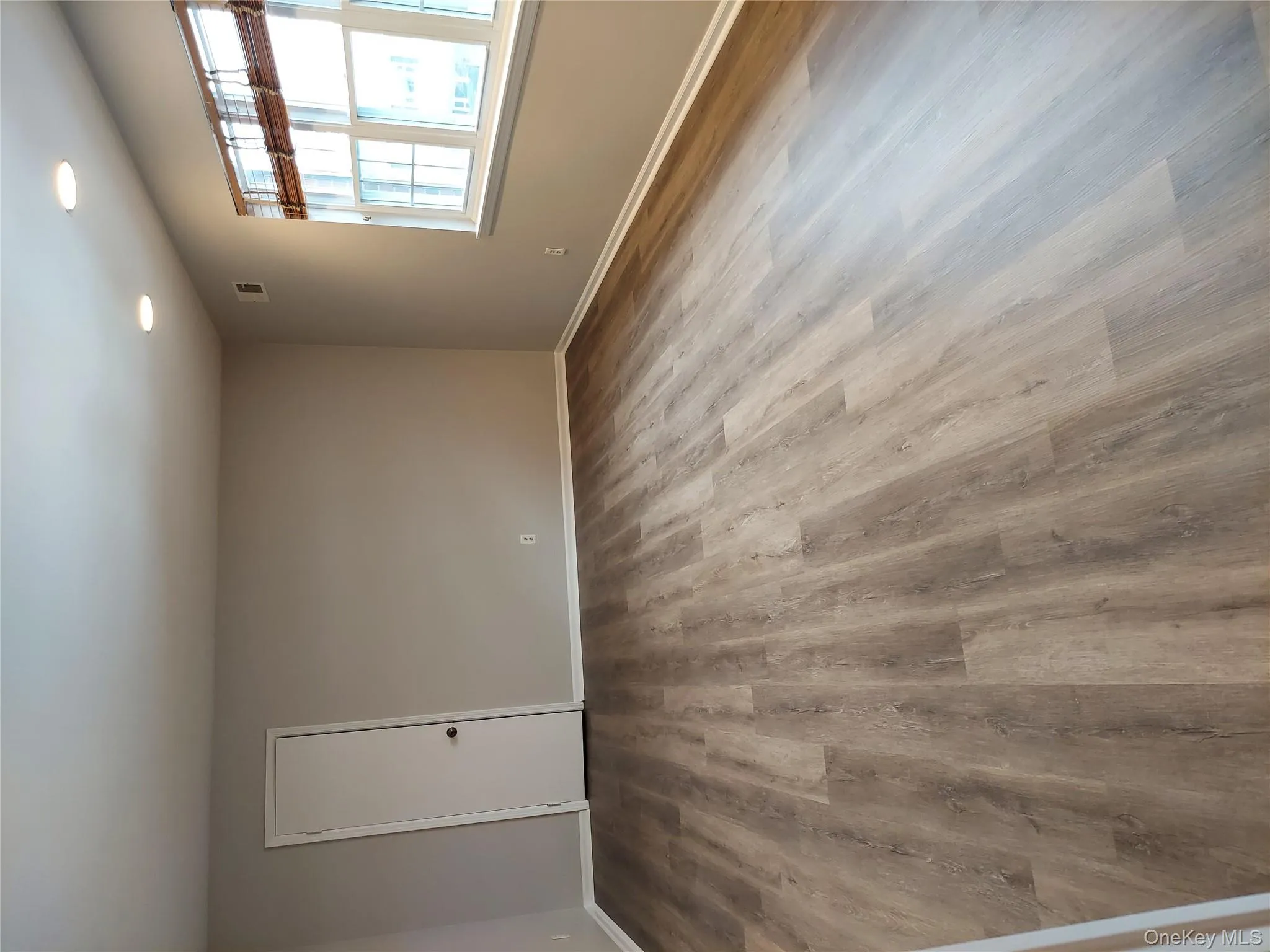 Living room featuring recessed lighting, new floorings. 3 windows. Freshly painted. View of walk in closet. Living room featuring recessed lighting, new floorings. 3 windows. Freshly painted. View of walk in closet.