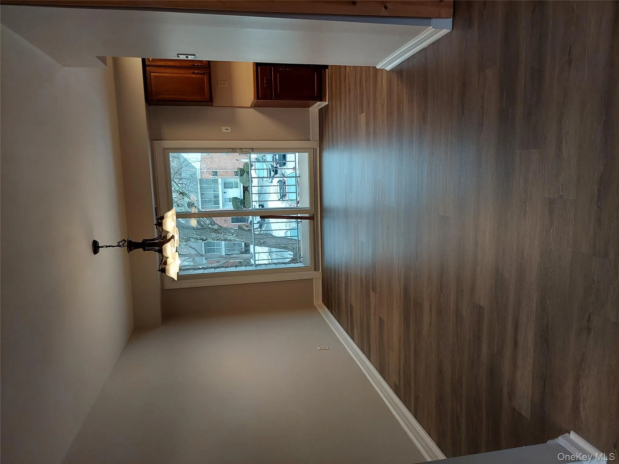 Unfurnished dining area featuring , a chandelier, New flooring and freshly painted Unfurnished dining area featuring , a chandelier, New flooring and freshly painted