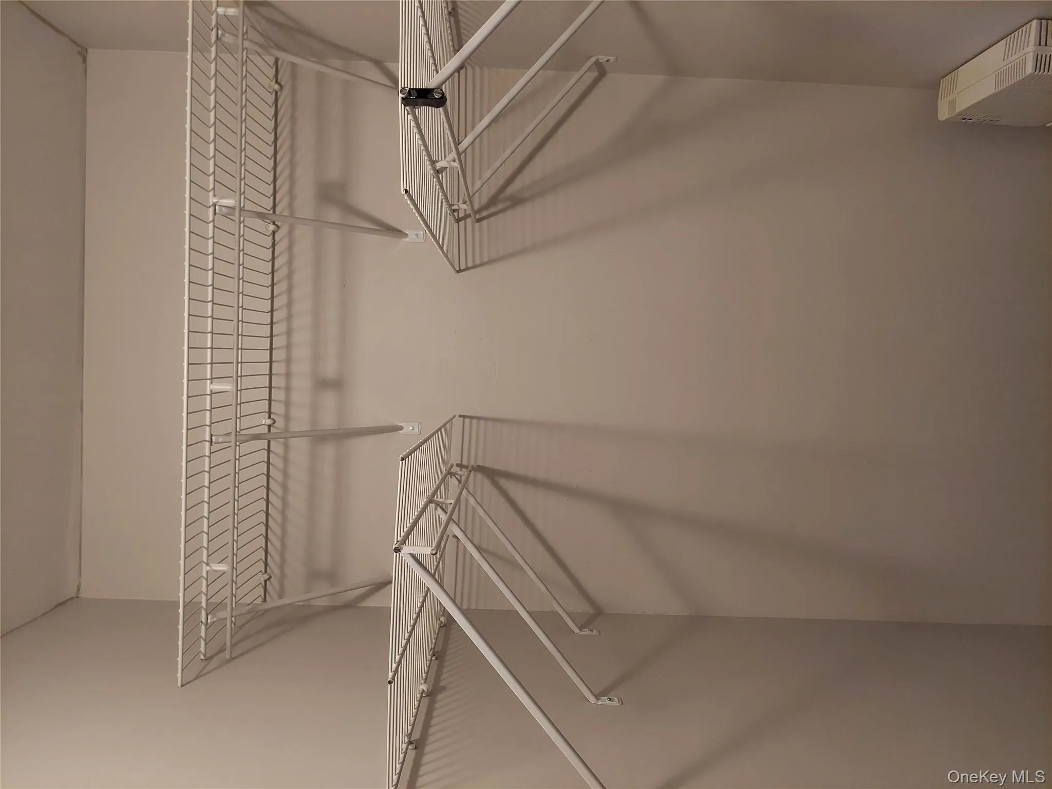 View of walk in closet in corridor. View of walk in closet in corridor.