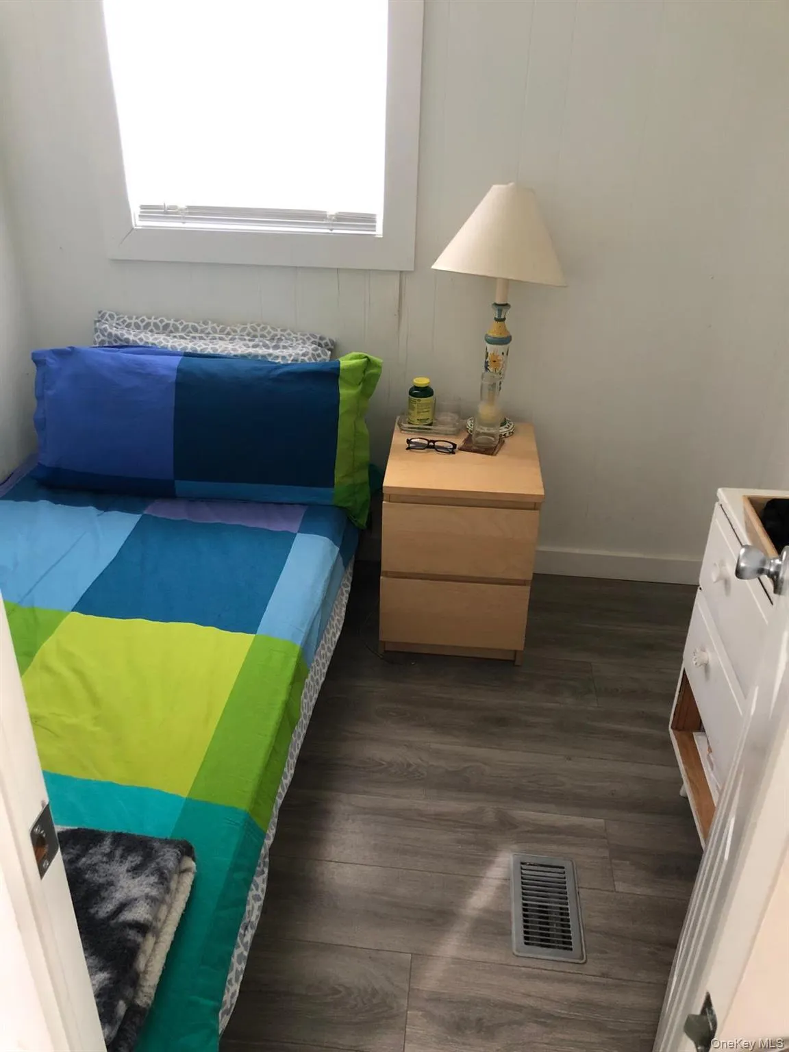 Bedroom featuring dark vinyl style floors Bedroom featuring dark vinyl style floors
