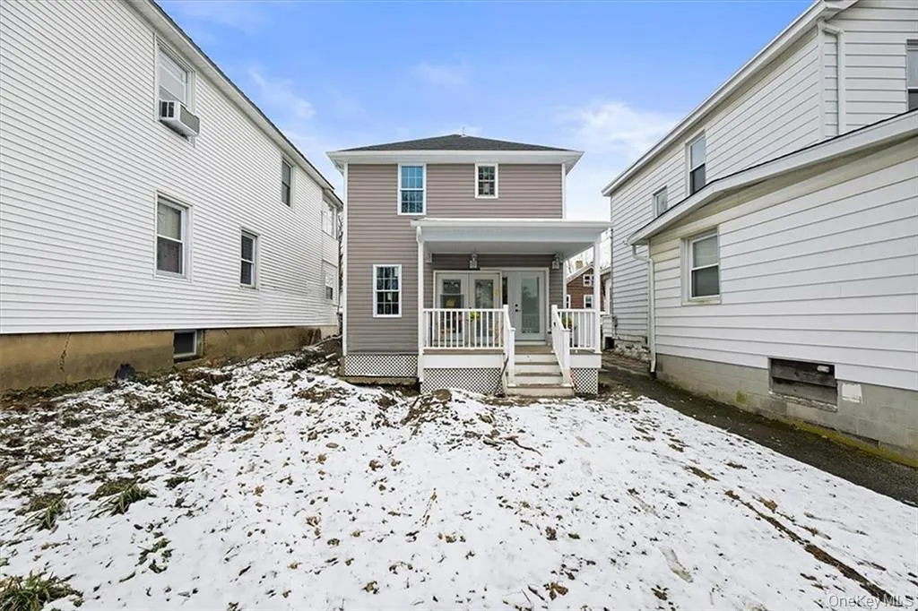 Charming rear porch entry. Charming rear porch entry.