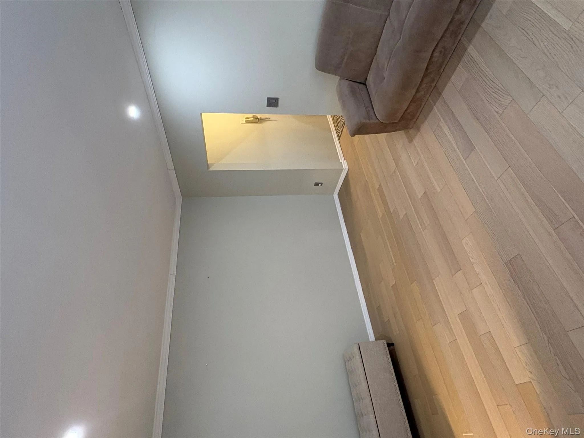 Sitting room with crown molding, light wood finished floors, and recessed lighting Sitting room with crown molding, light wood finished floors, and recessed lighting
