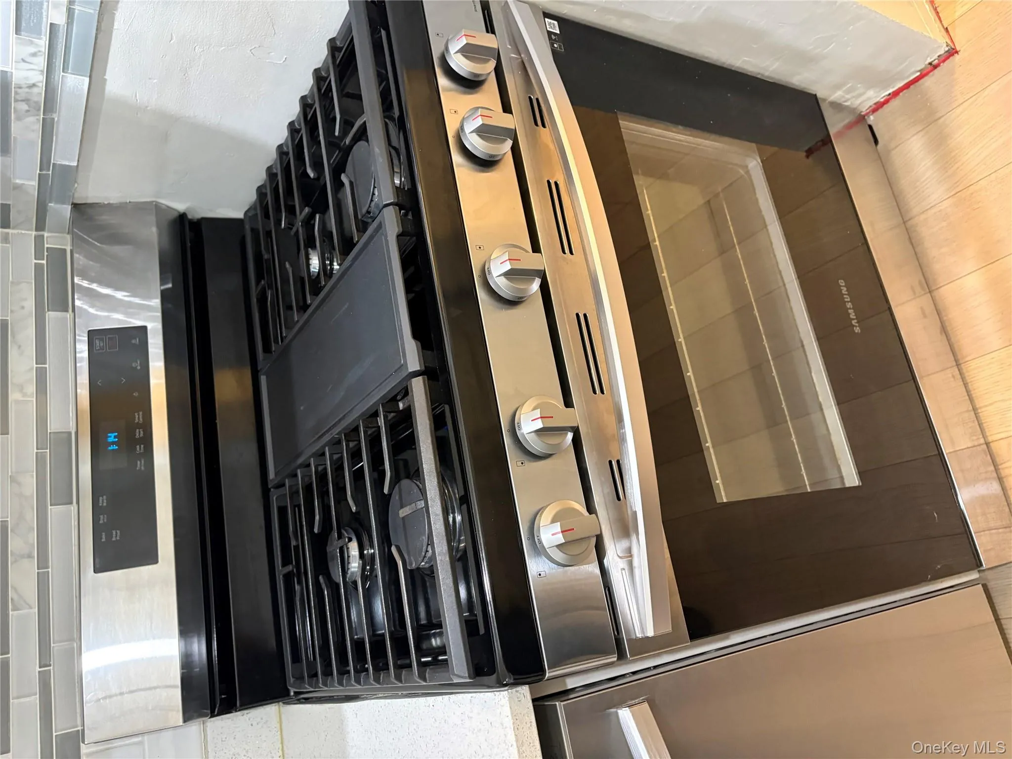 Kitchen view of stainless steel gas range oven Kitchen view of stainless steel gas range oven