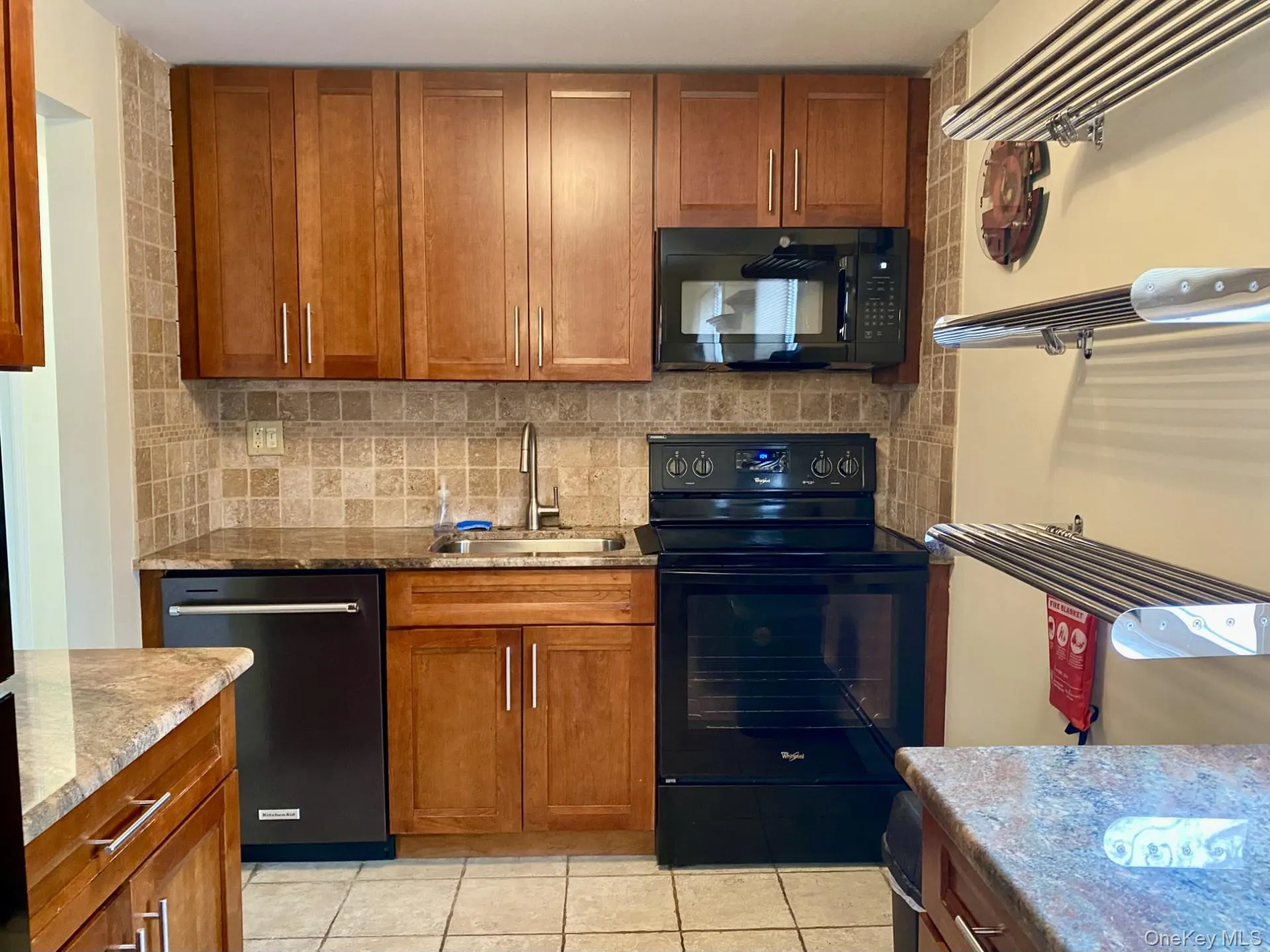 Kitchen featuring updated appliances, granite counters Kitchen featuring updated appliances, granite counters