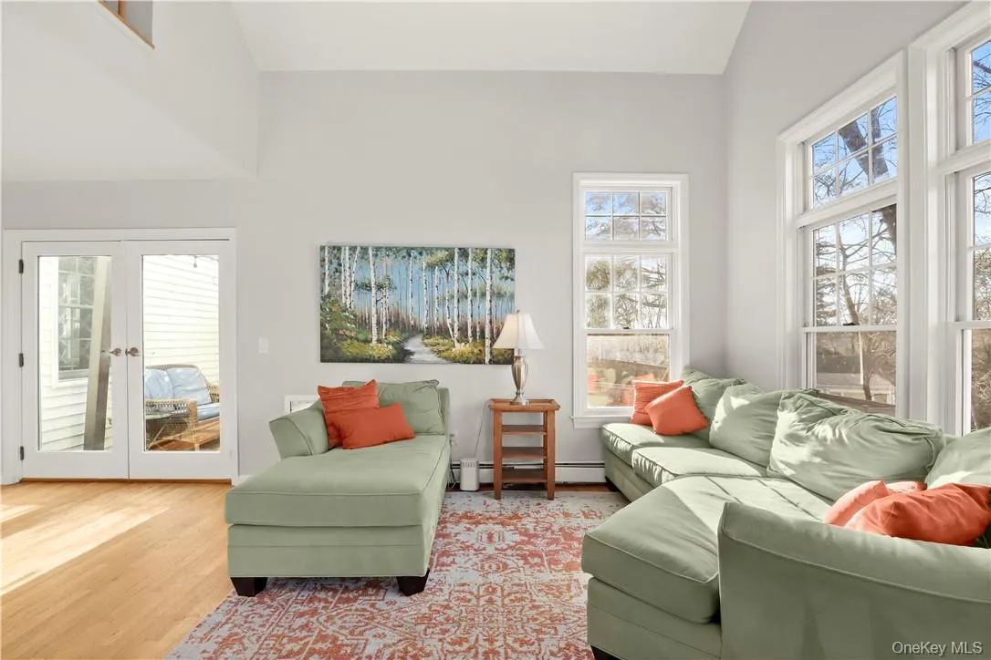 Family Room on the main level with door to deck Family Room on the main level with door to deck