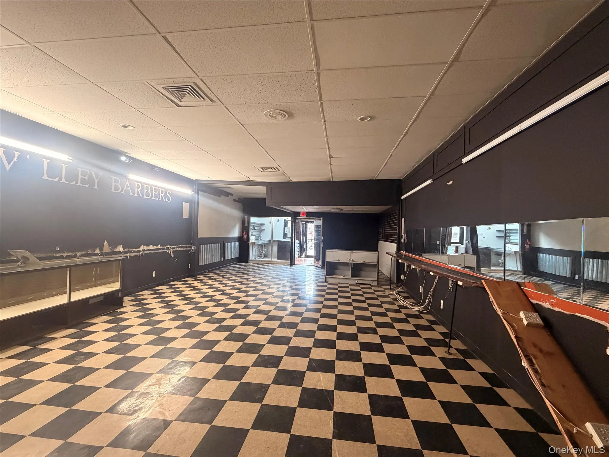 Spacious main-level retail area with high visibility and open layout • Large storefront showroom ideal for retail or customer-facing business Spacious main-level retail area with high visibility and open layout • Large storefront showroom ideal for retail or customer-facing business