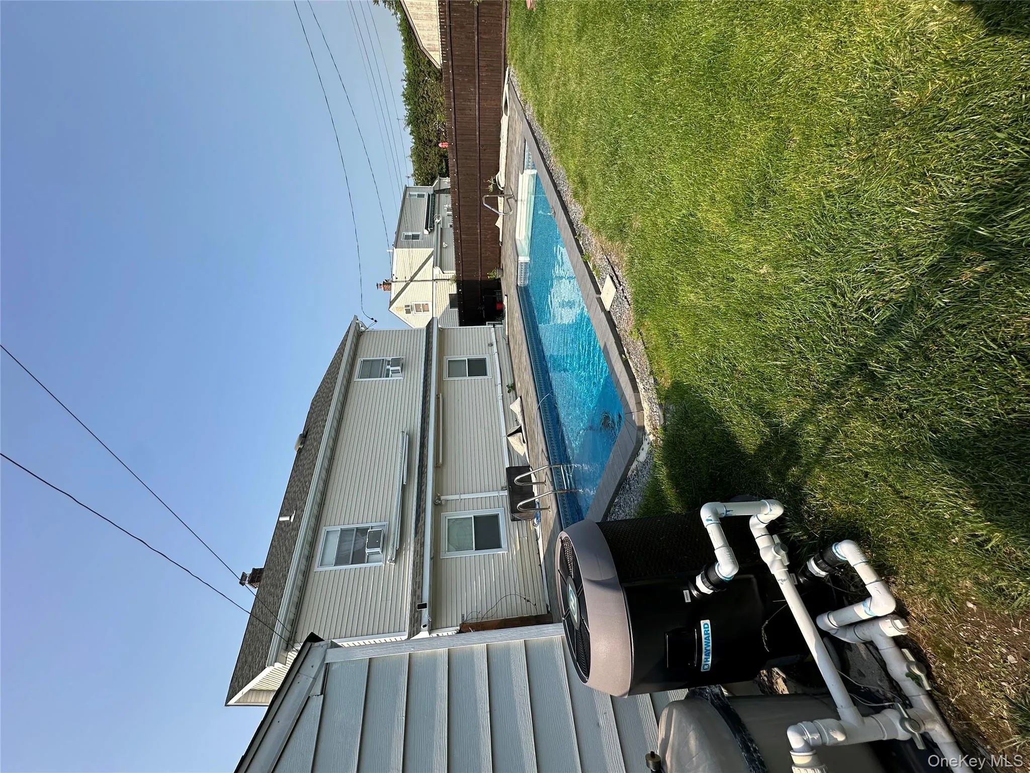 View of pool with a fenced backyard View of pool with a fenced backyard