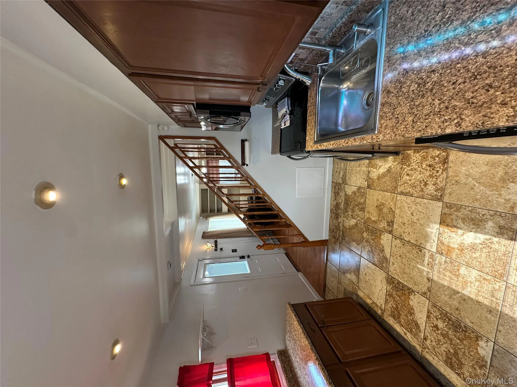 Kitchen with stove and dark countertops Kitchen with stove and dark countertops