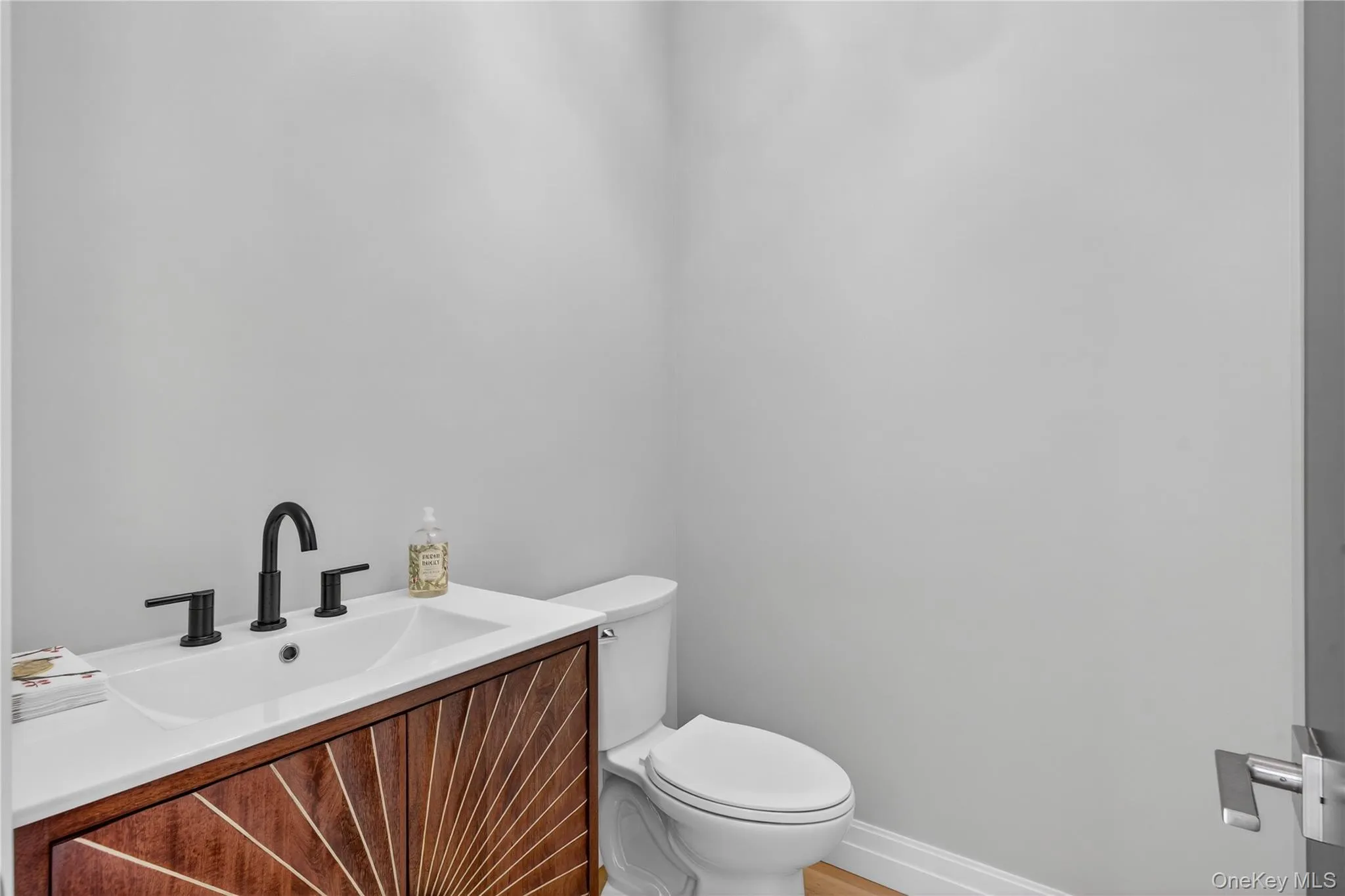 Bathroom featuring vanity and toilet Bathroom featuring vanity and toilet