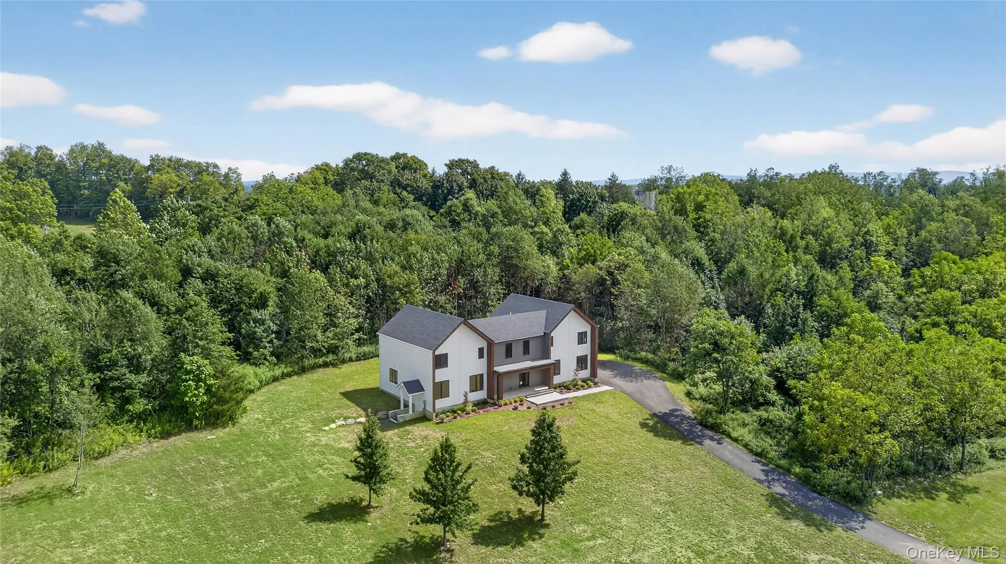 View from above of property with a forest View from above of property with a forest