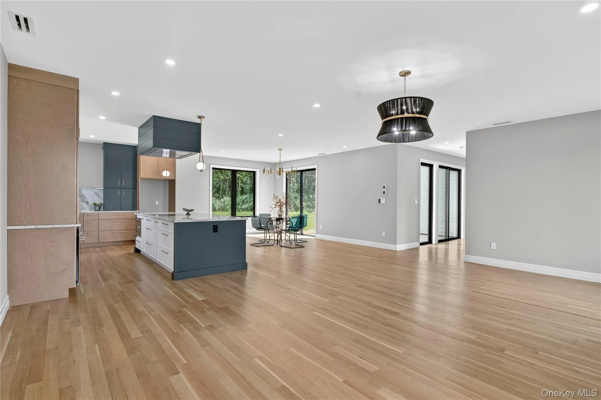 Unfurnished living room with recessed lighting and light wood finished floors Unfurnished living room with recessed lighting and light wood finished floors