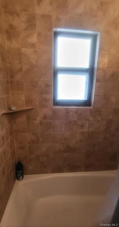 Clean, tiled bathroom. Clean, tiled bathroom.