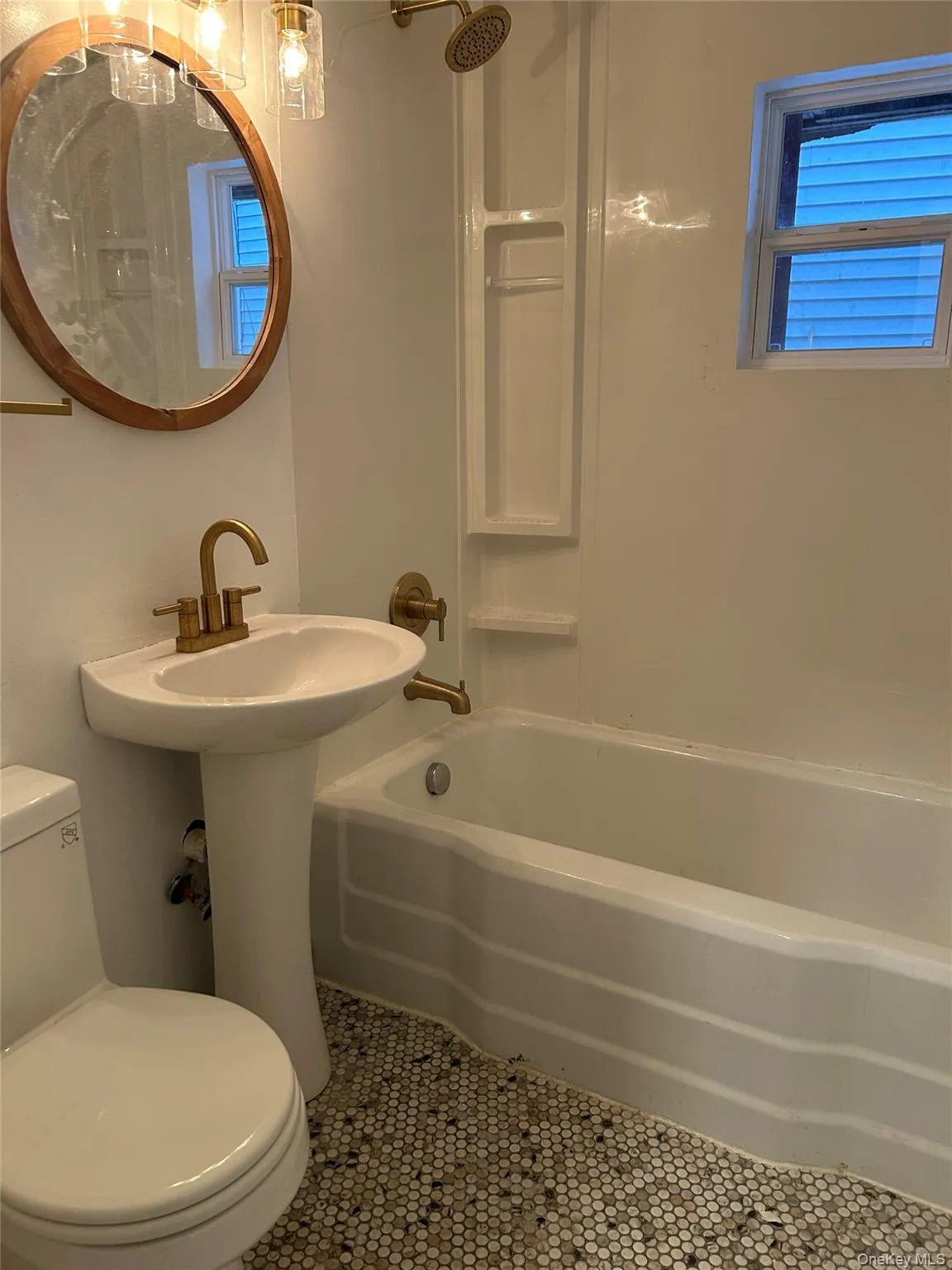 Full bath with bathing tub / shower combination and tile patterned flooring Full bath with bathing tub / shower combination and tile patterned flooring