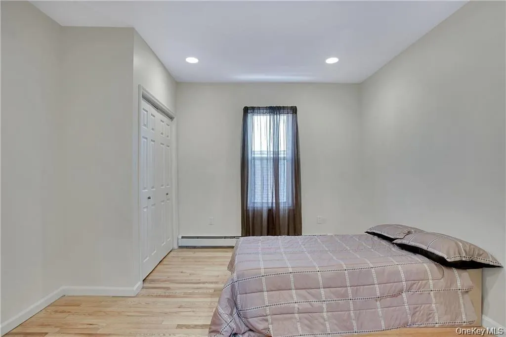 Bright bedroom with a window for natural light and a simple, functional layout. Bright bedroom with a window for natural light and a simple, functional layout.