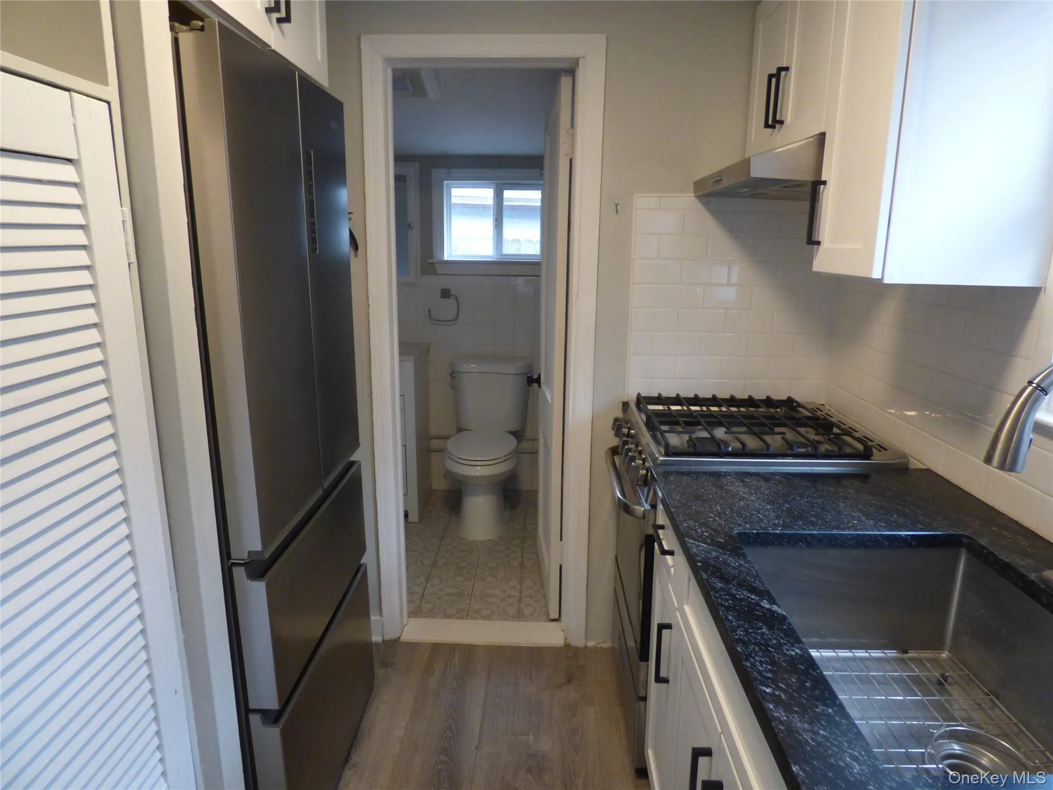 White cabinets, granite counters White cabinets, granite counters