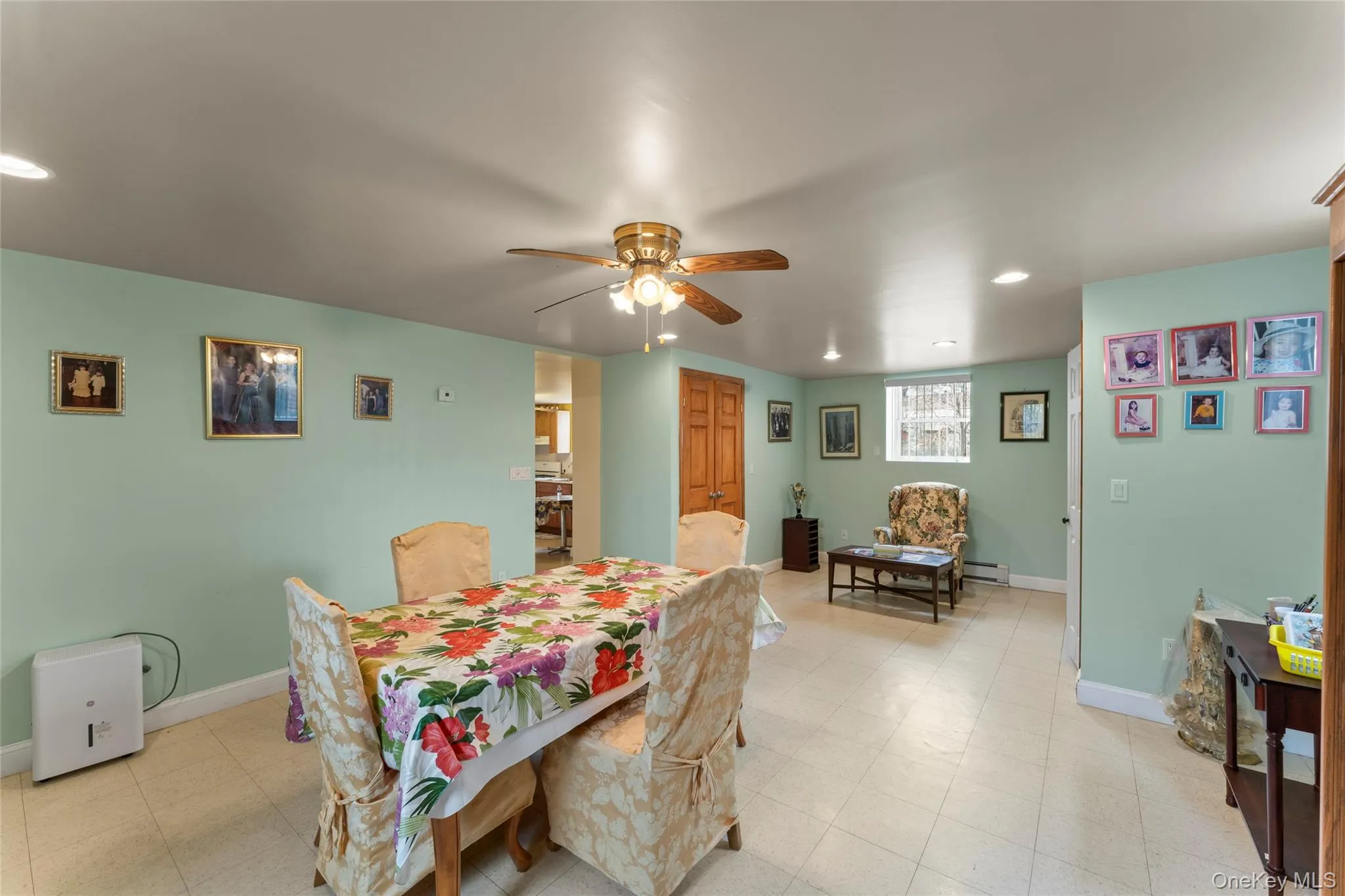 Dining area featuring recessed lighting, a ceiling fan, light floors, and a baseboard radiator Dining area featuring recessed lighting, a ceiling fan, light floors, and a baseboard radiator